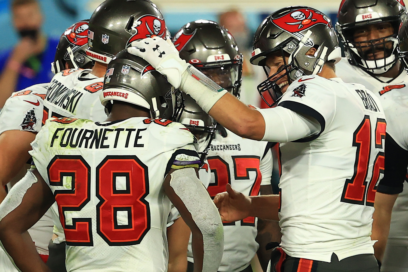 Tom Brady was all smiles with his Buccaneers teammates in the fourth quarter of Super Bowl LV.