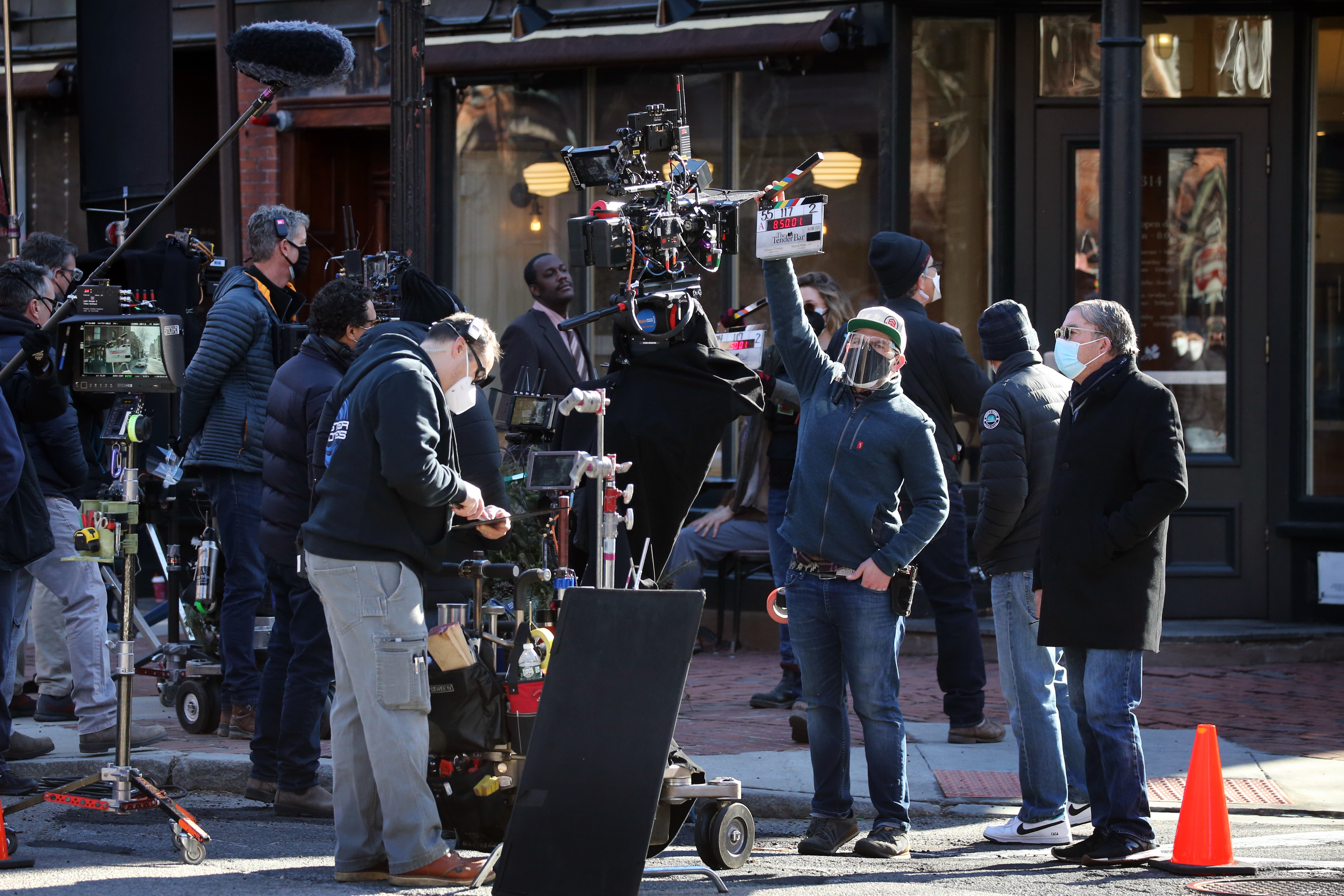 A film crew prepares to shoot a scene for "The Tender Bar" at the South End Buttery in Boston on March 10, 2021.