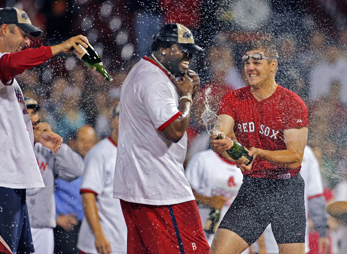 The Red Sox clinched the AL East with a win over the Twins Sept. 28 (and were helped by the Yankees losing to the Devil Rays). Tim Wakefield (far left), Ortiz, and Jonathan Papelbon (right) broke out the champagne to celebrate.