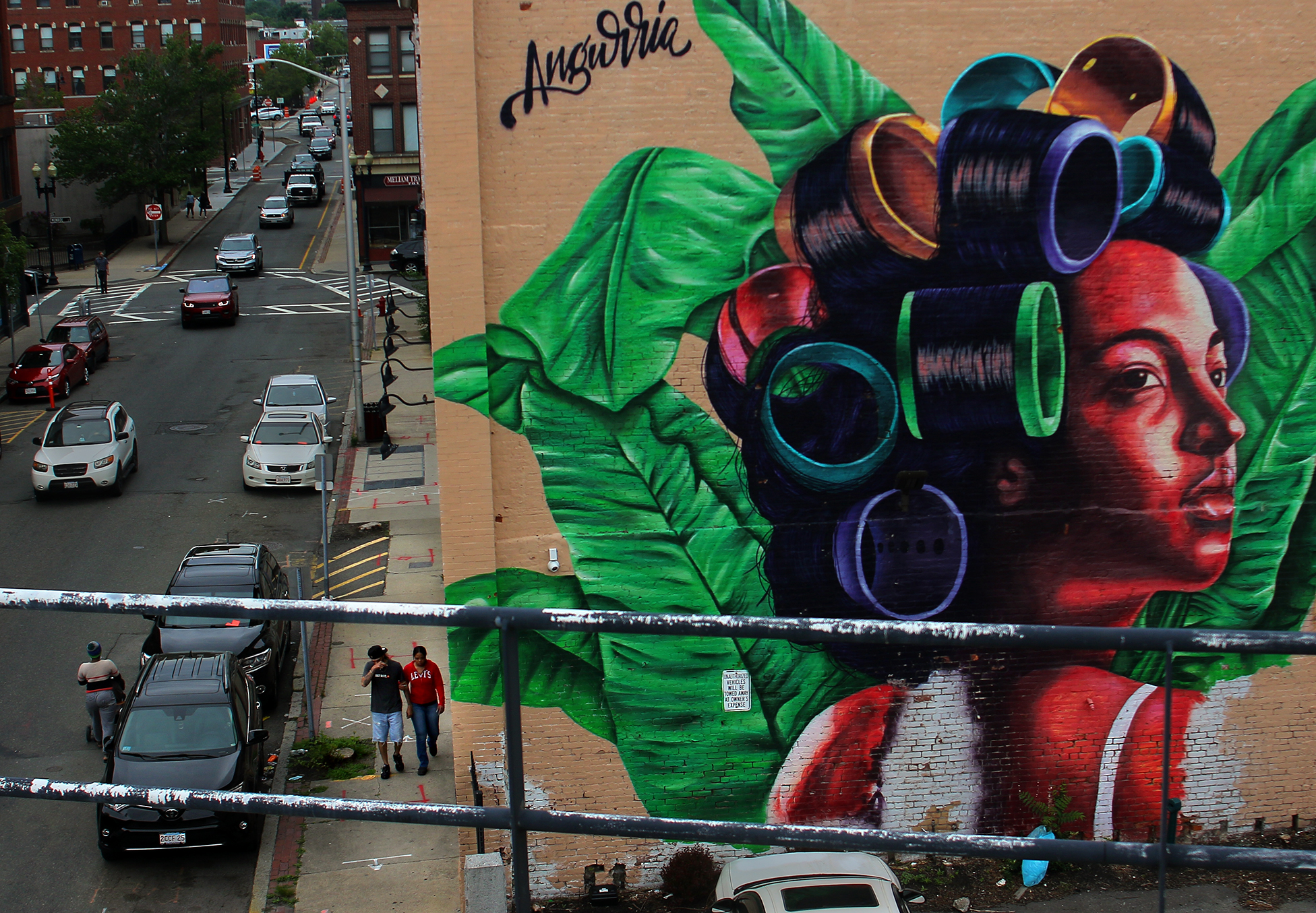 A building on Washington Street in Lynn is graced with a mural by Dominican artist Evaristo Angurriae.