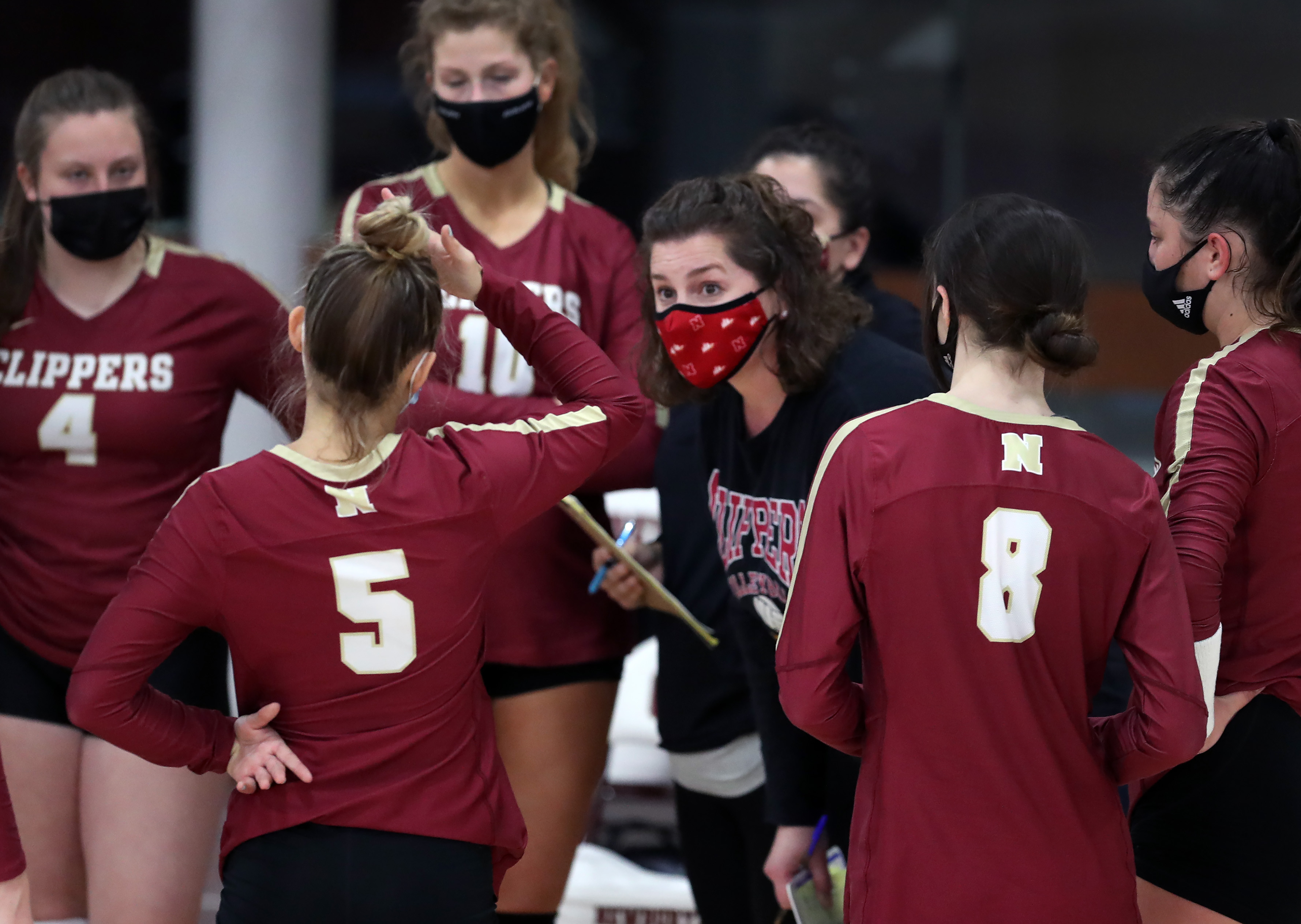 Speaking on the growth of her program, Newburyport girls' volleyball coach Lori Solazzo (center) said, "These past three years, these girls have really been working together and building something together."