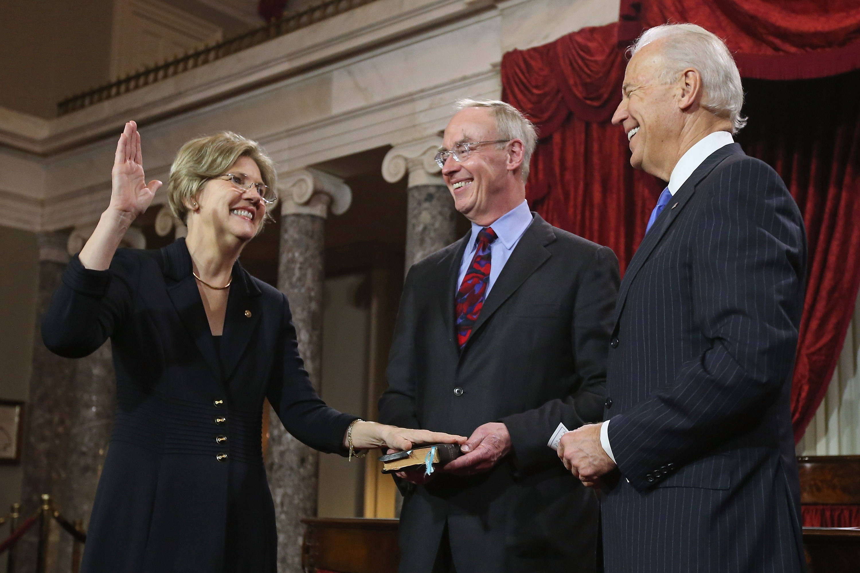 Senator Elizabeth Warren participated in a reenacted swearing-in with her husband, Bruce Mann, and then-Vice President Joe Biden in Washington in 2013.