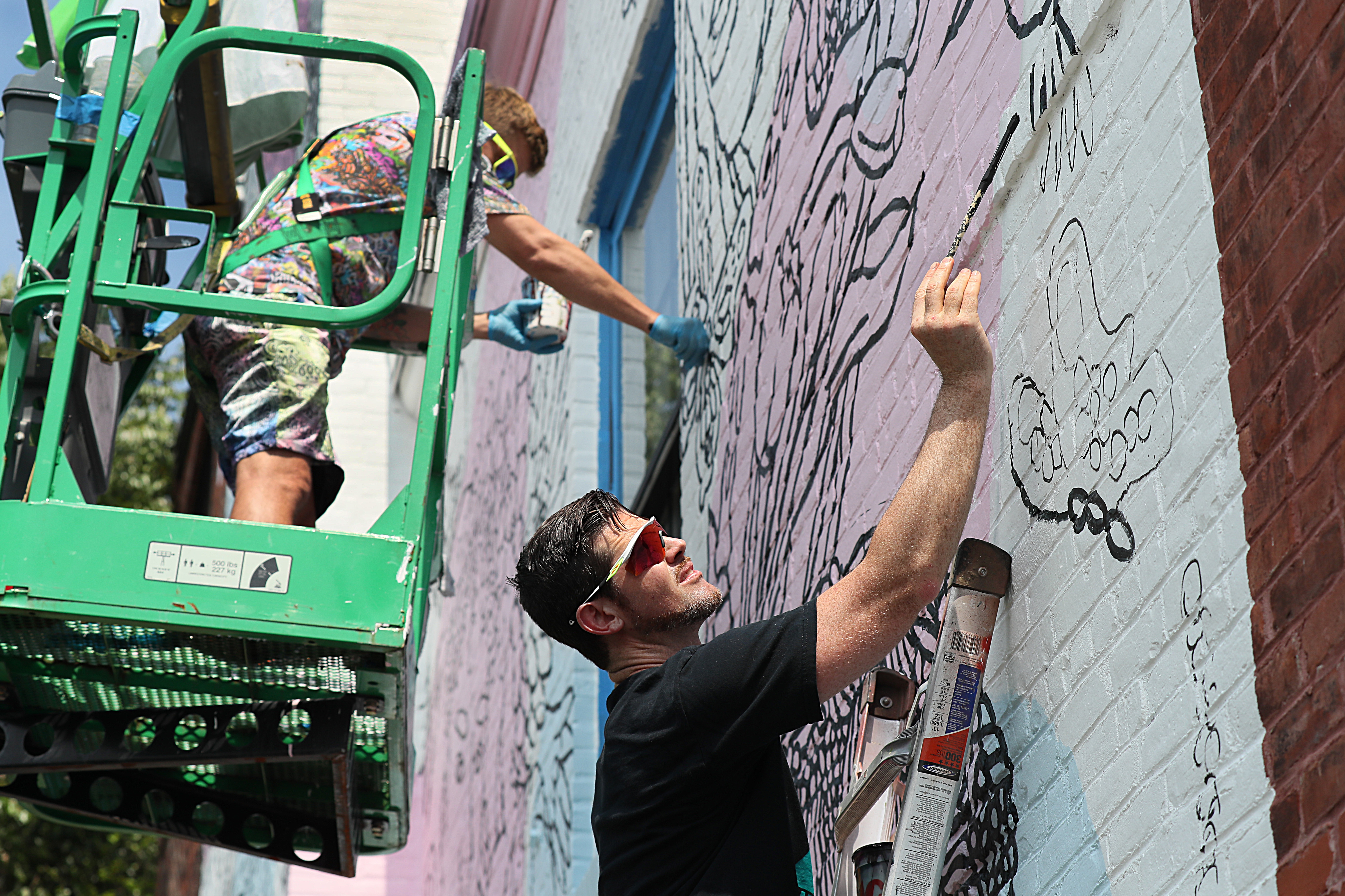 Open Door Health opened March 2, 2020 and is now Rhode Island’s first health clinic that specializes in primary care, sexual health and other health initiatives for the LGBTQ+ community. Brian Kenny is working on a large-scale mural at the clinic. He was commissioned by the Avenue Concept.