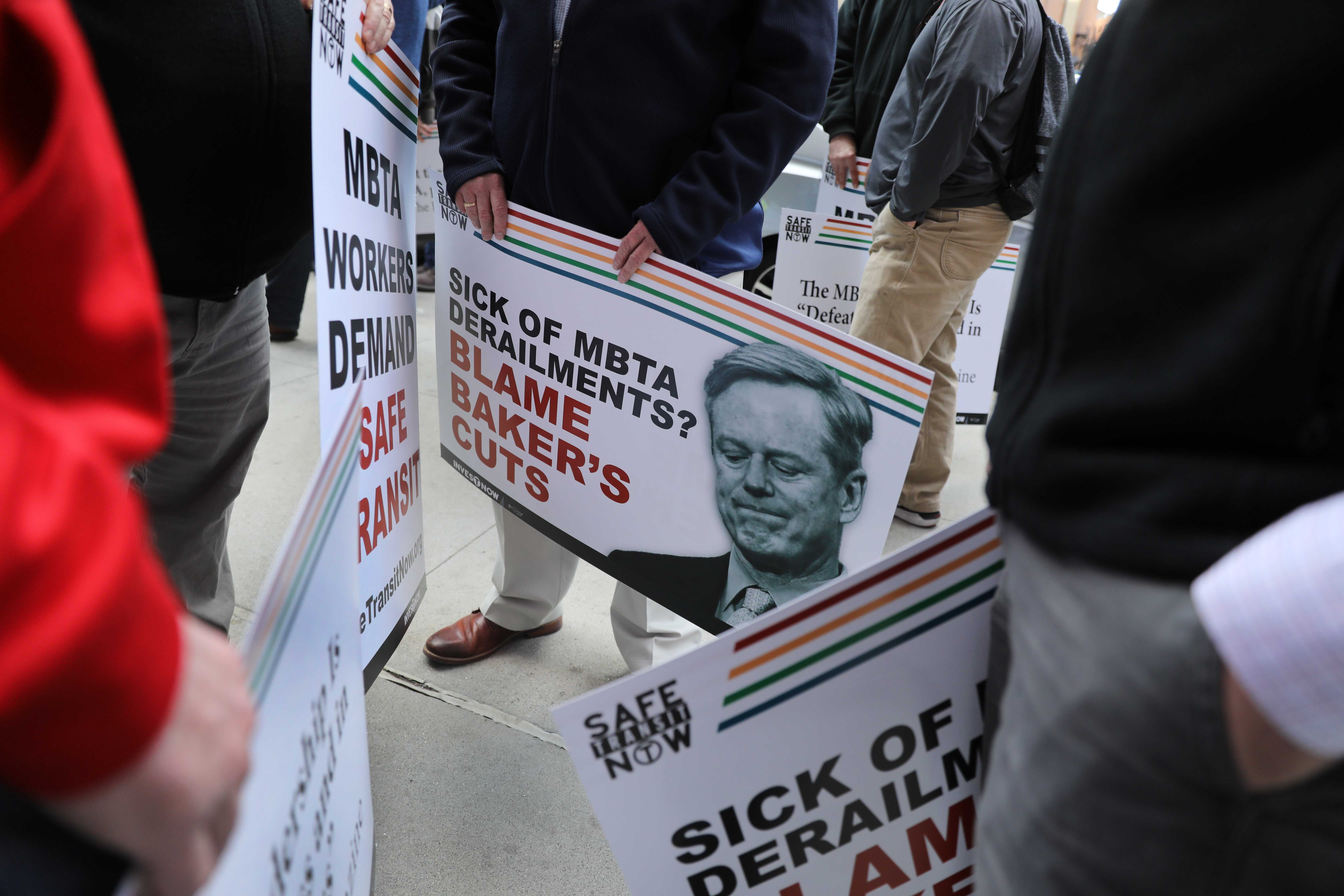 Workers and riders protested MBTA cuts in workforce maintenance during a demonstration in front of the Transportation Building on March 9.