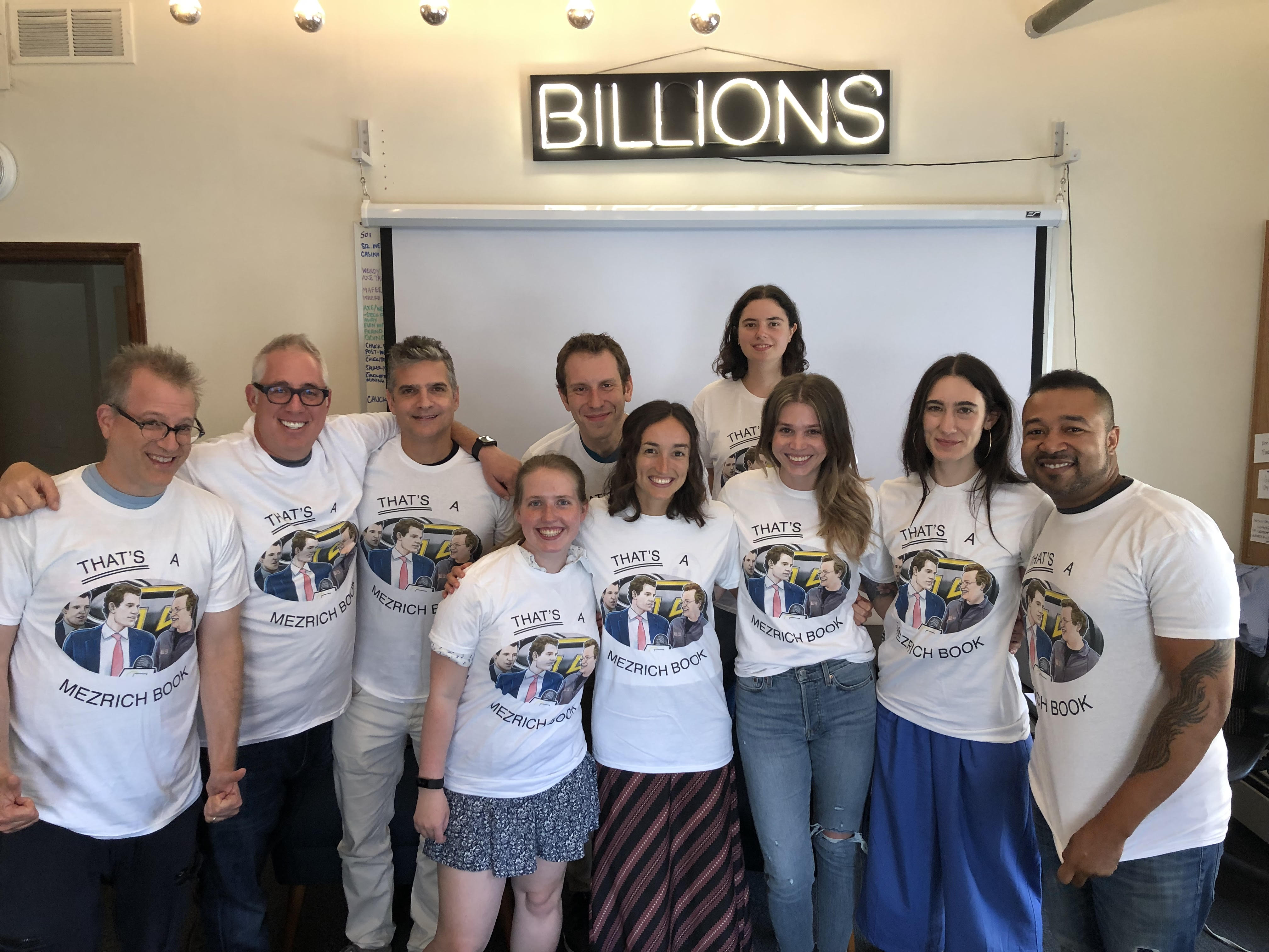 Ben Mezrich (left) in the "Billions" writers' room wearing a prank T-shirt.