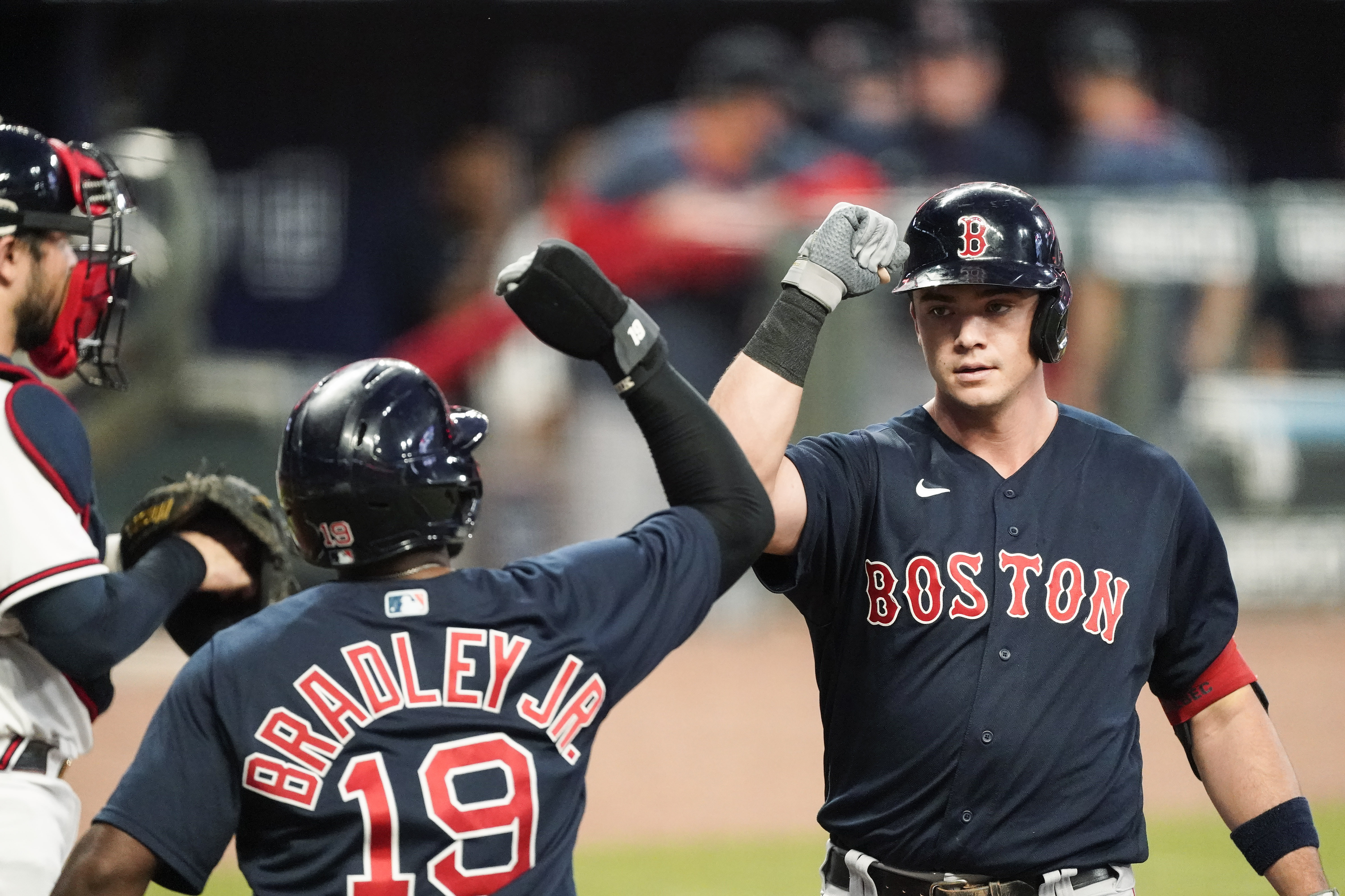 Bobby Dalbec (right) is congratulated by Jackie Bradley Jr. after belting a two-run homer to kick off the Sox' eight-run second