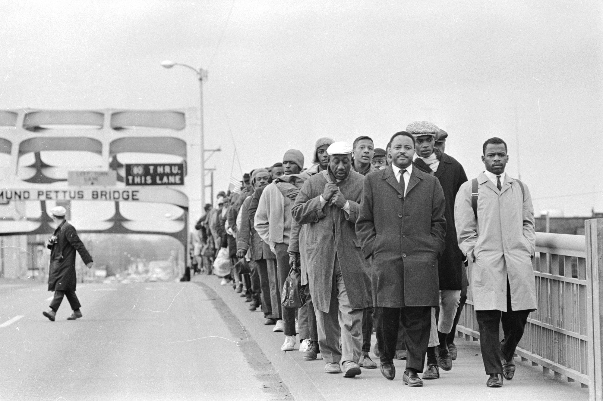 John Lewis, right, with fellow protesters at the Edmund Pettus Bridge during the 1965 march from Selma to Montgomery, Ala., in "John Lewis: Good Trouble."