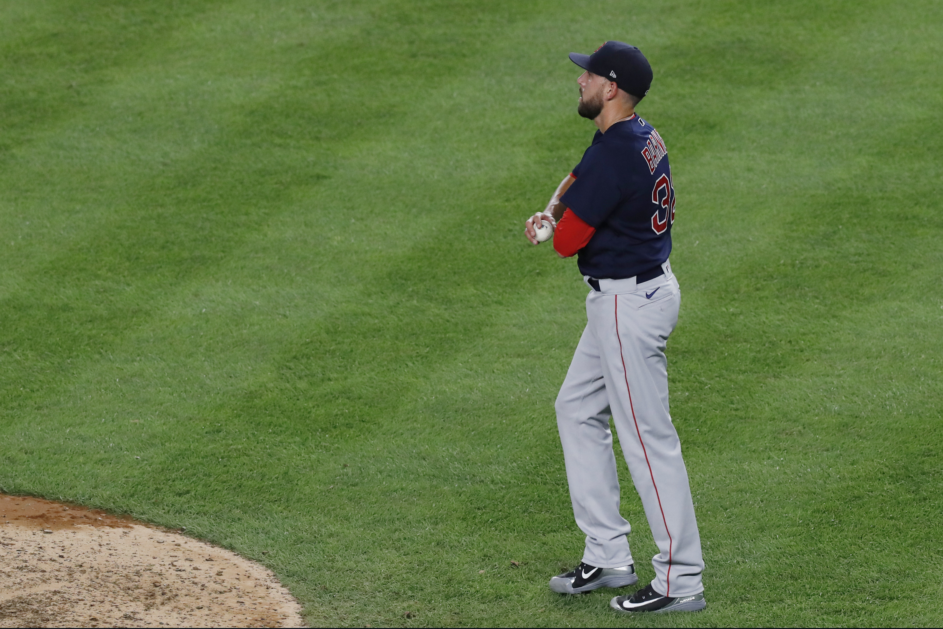 Matt Barnes looks to the outfield after allowing a two-run home run to Aaron Judge in the eighth inning of Sunday's game.