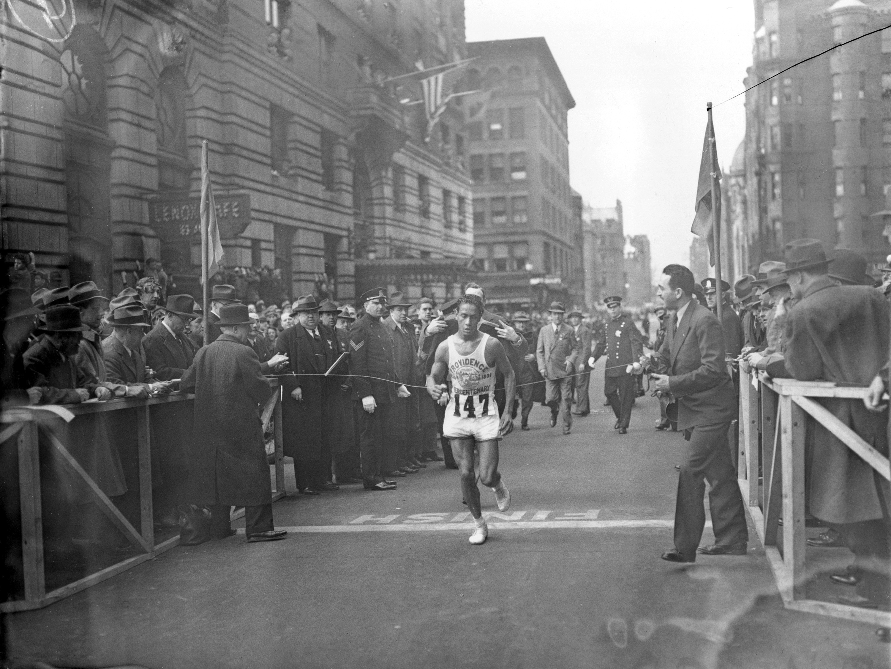 Ellison "Tarzan" Brown breaks the tape to win the 1936 Boston Marathon.