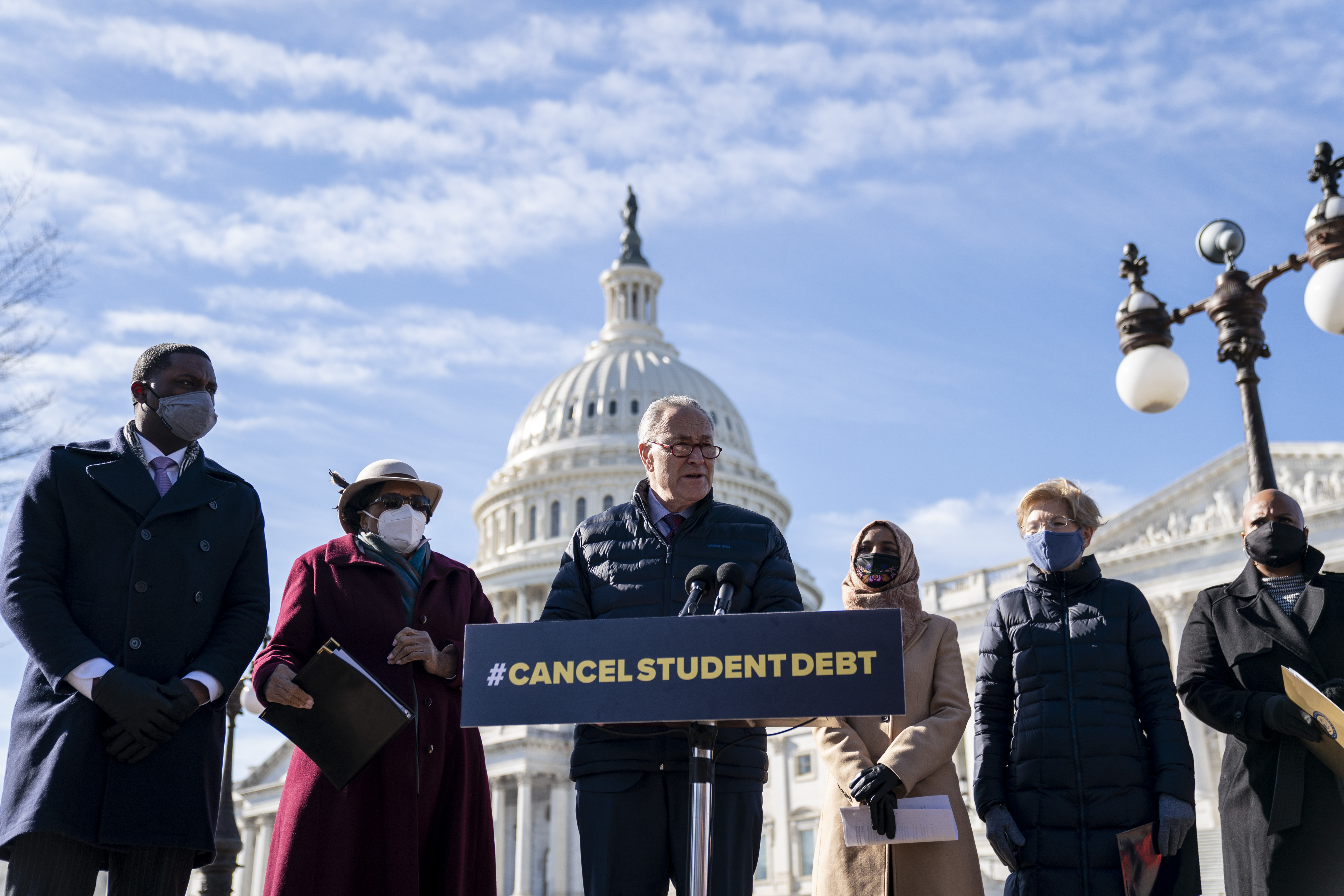 Senate Majority Leader Chuck Schumer spoke during a press conference about student debt outside the US Capitol on Thursday in Washington, DC. Also pictured, left to right, Rep. Mondaire Jones, Rep. Alma Adams, Rep. Ilhan Omar, Sen. Elizabeth Warren and Rep. Ayanna Pressley. The group of Democrats re-introduced their resolution calling on President Joe Biden to take executive action to cancel up to $50,000 in debt for federal student loan borrowers.