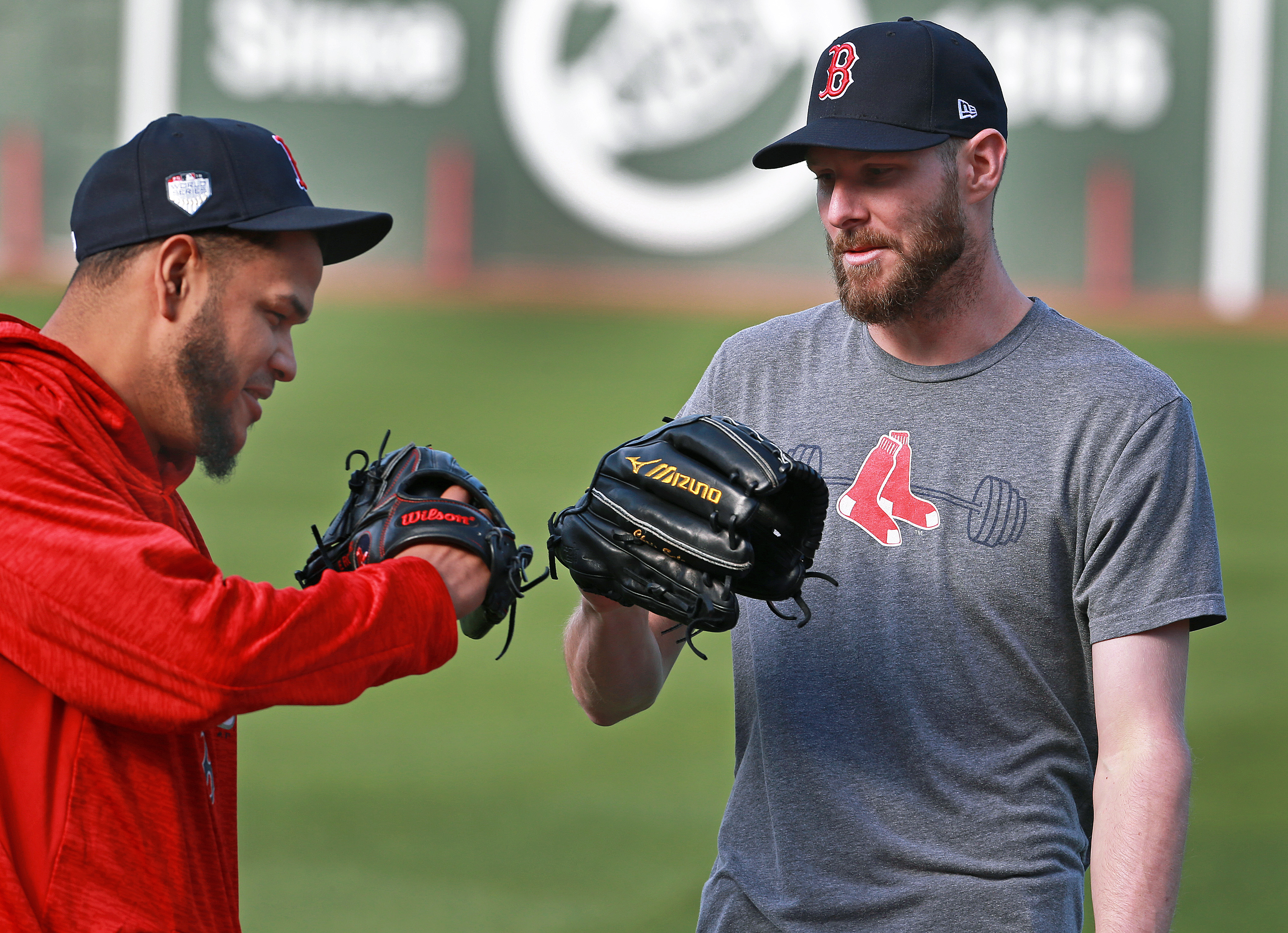 Boston Red Sox second baseman Mark Bellhorn walks in the rain past