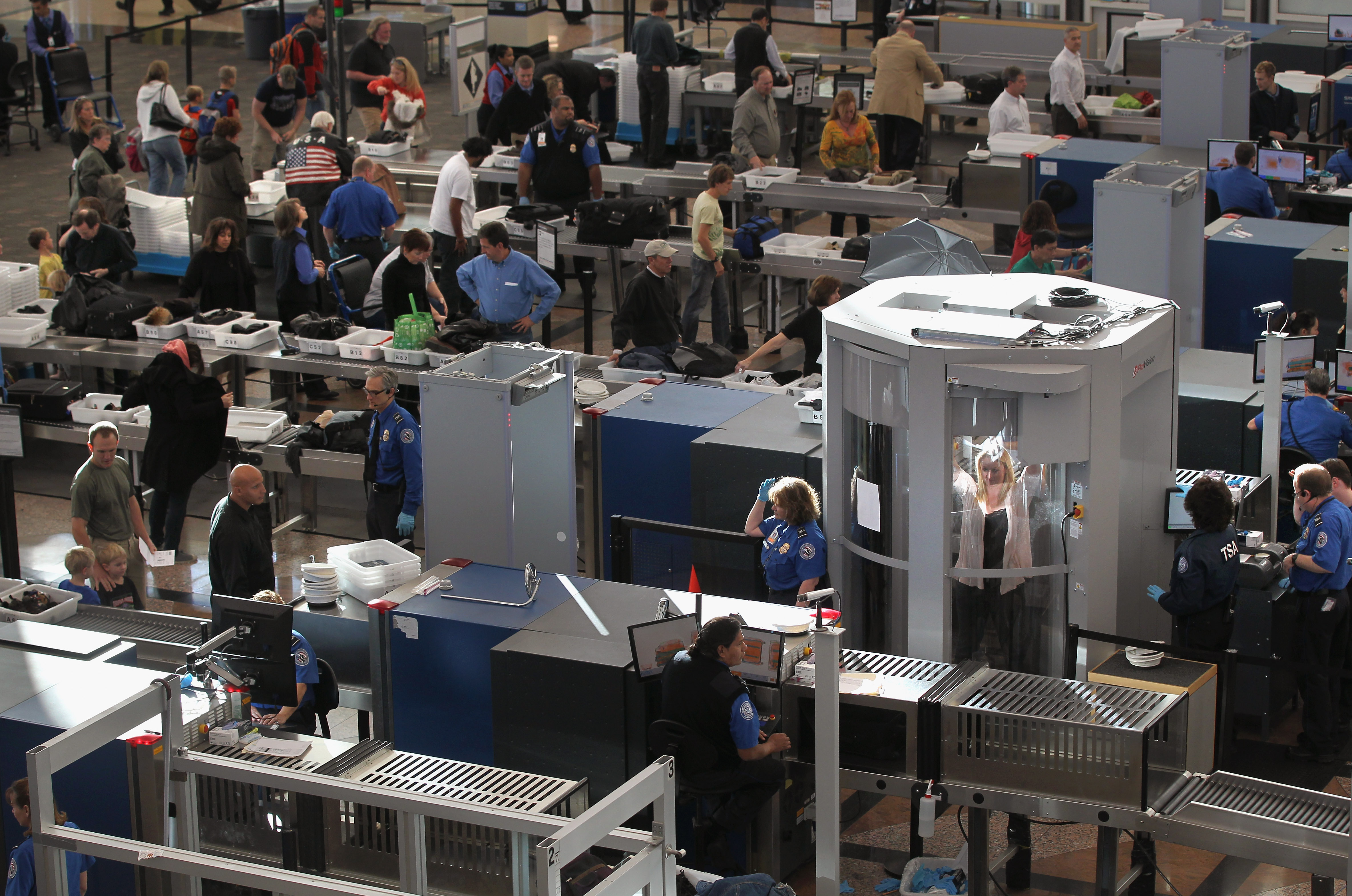 A traveler underwent a full-body scan performed by Transportation Security Administration agents as she and others passed through the security checkpoint at the Denver International Airport on Nov. 22, 2010. At the time, the TSA was bracing for heavy traffic the day before Thanksgiving, as two separate internet campaigns were promoting a "National Opt-Out Day" protest, during which travelers are urged to "opt out" of the new body scanners because of concerns over privacy and possible exposure to radiation. Those passengers who refused the scans would instead have to undergo an enhanced pat down by TSA agents, which could further slow down security lines on the busiest air travel day of the year.