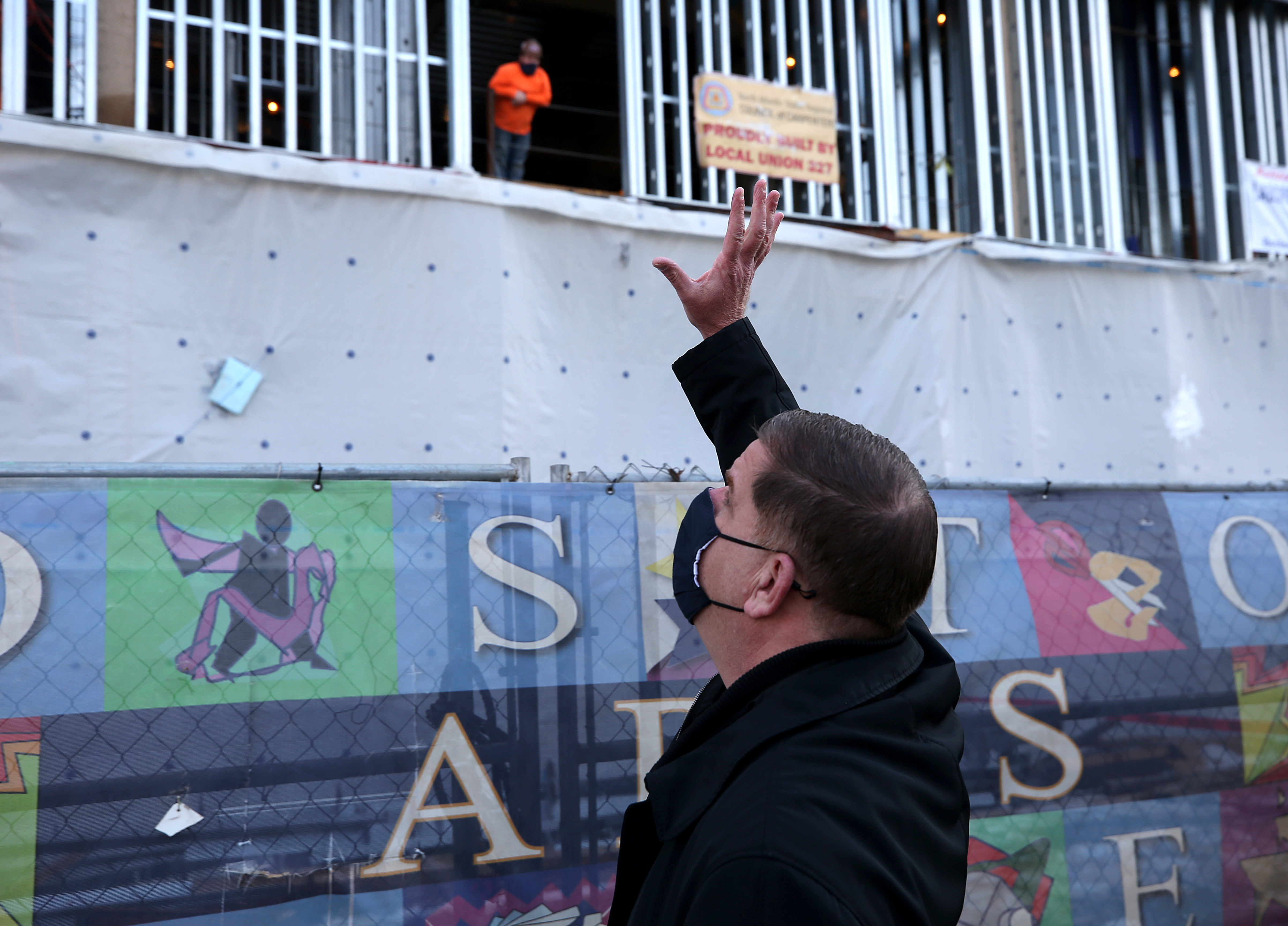 Mayor Walsh, greeting construction workers at the new, $125 million Boston Arts Academy facility.