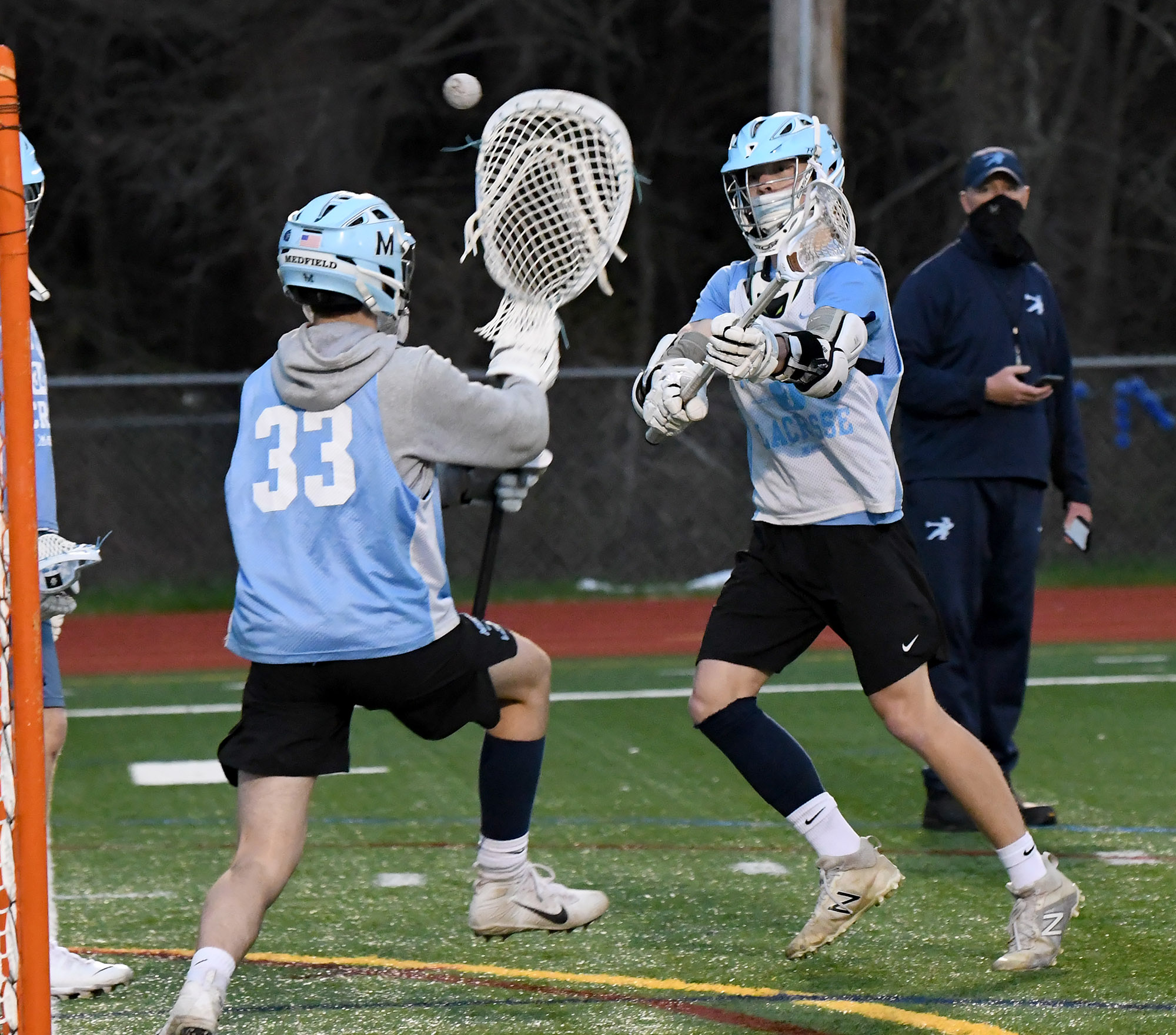 A pair of Medfield players work through a drill at Wednesday night's practice session.