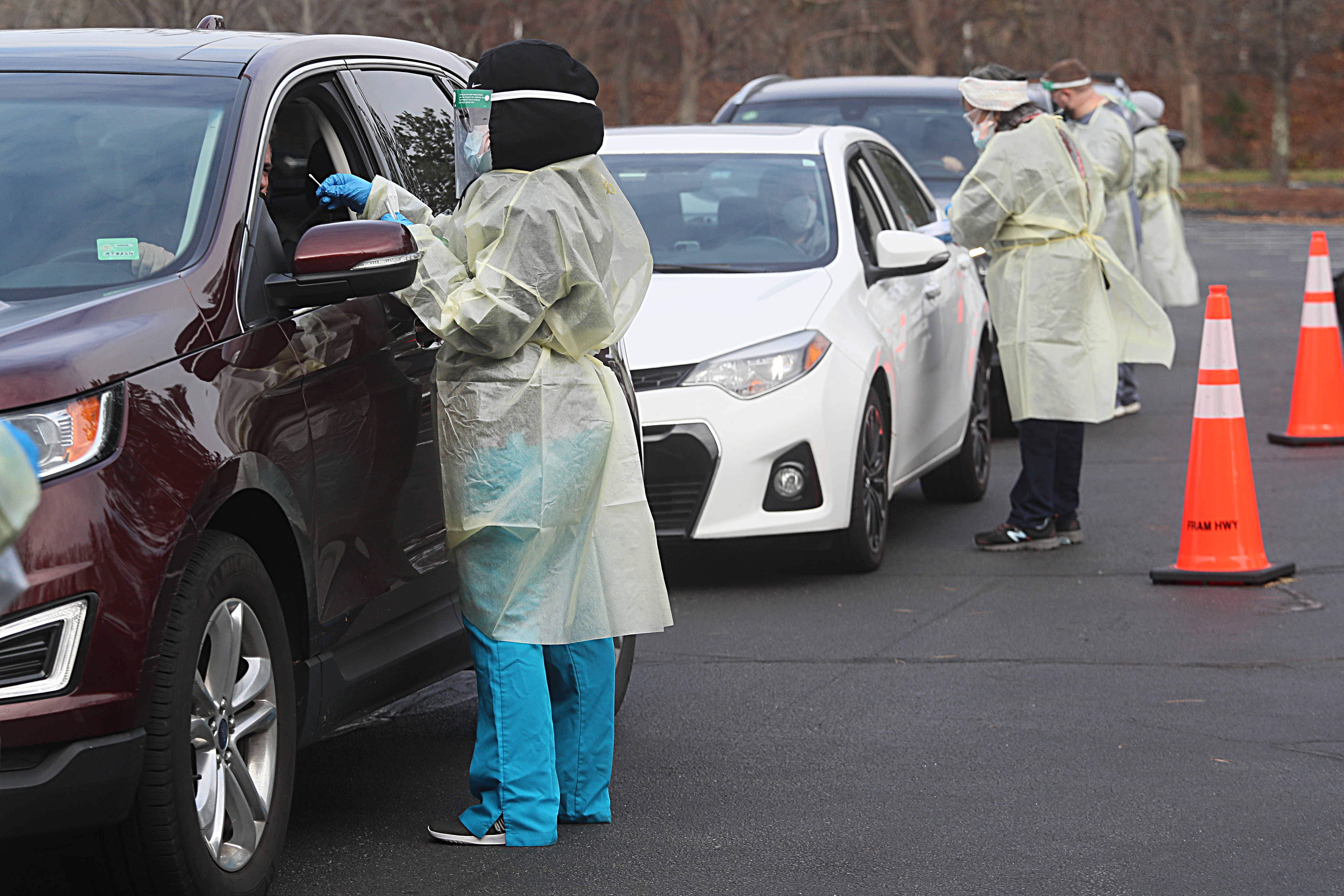 Lines of cars carried people to get tested for COVID-19 in the parking lot of TJX Companies Inc. in Framingham on Nov. 17.