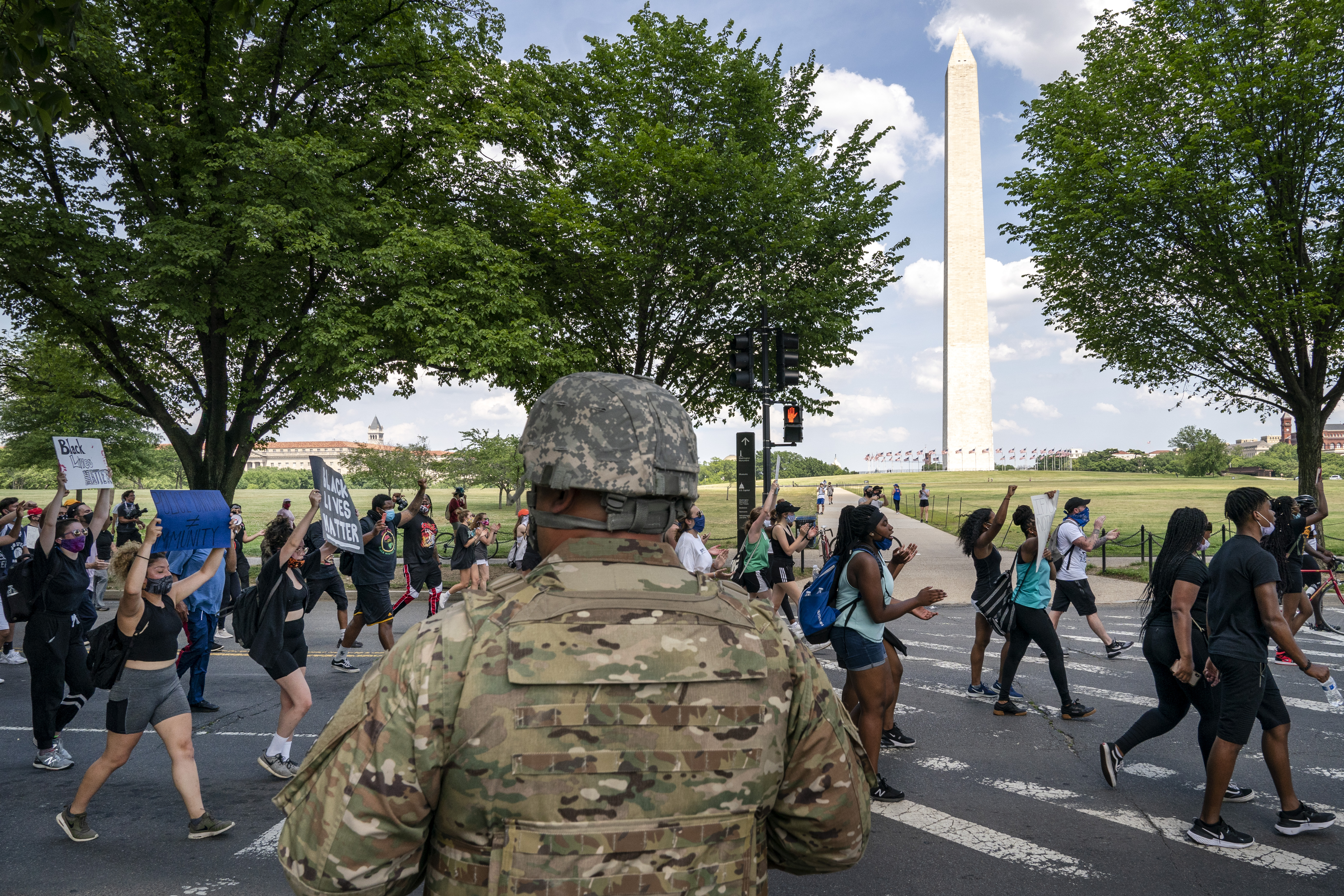 Demonstrators peacefully marched from the White House to the Martin Luther King, Jr. Memorial as they participated in a protest against police brutality and the death of George Floyd Thursday.