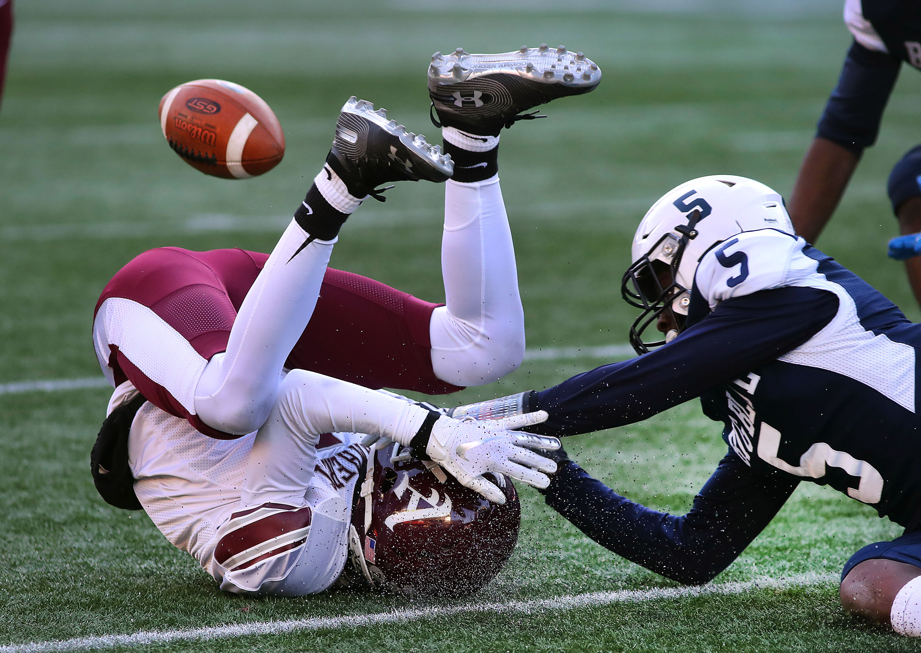 Amherst-Pelham’s Zayd Sadiq was head over heels after dropping a long pass in the Division 5 Super Bowl.