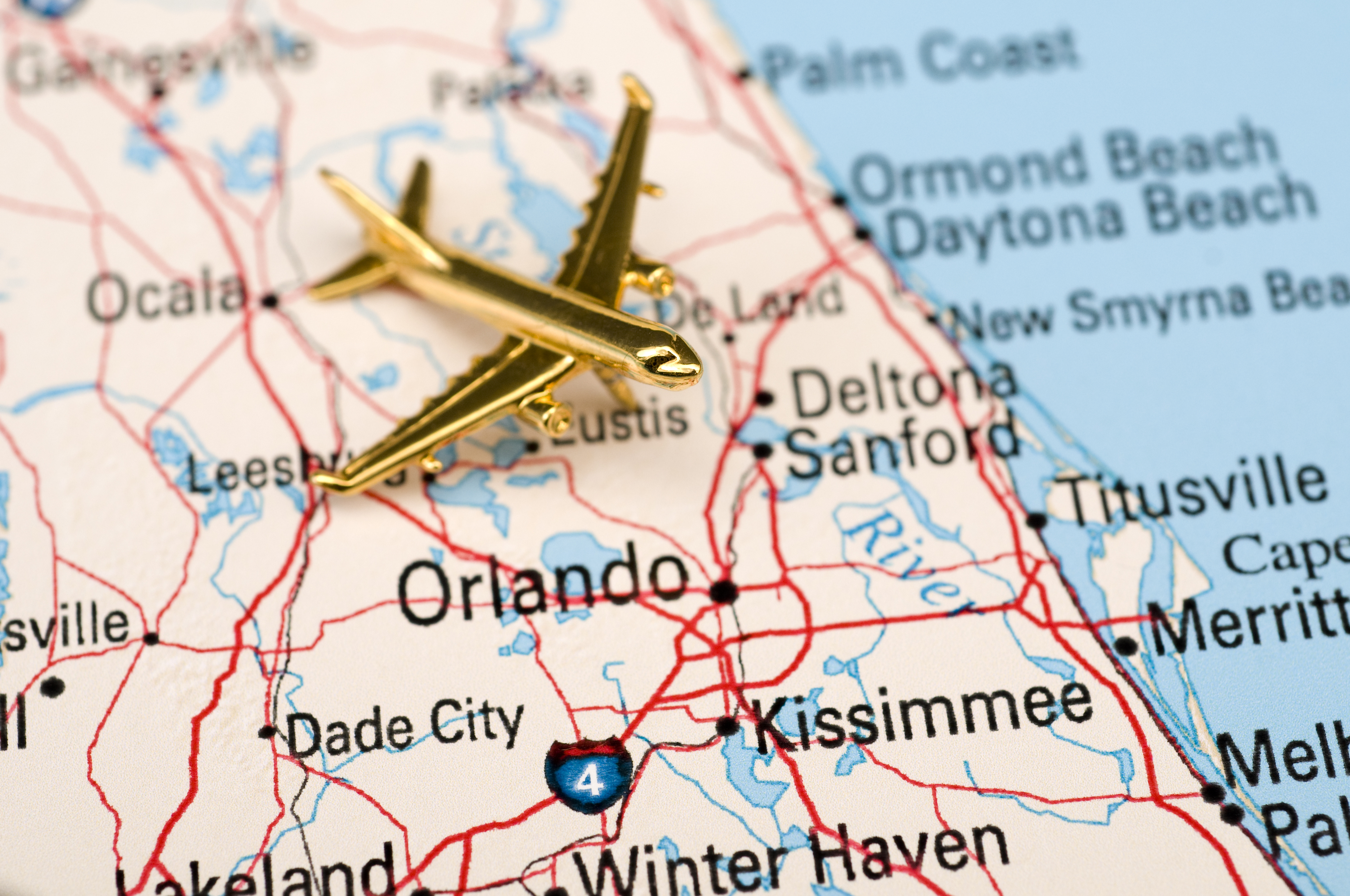 Map of Florida with plane figure on top.