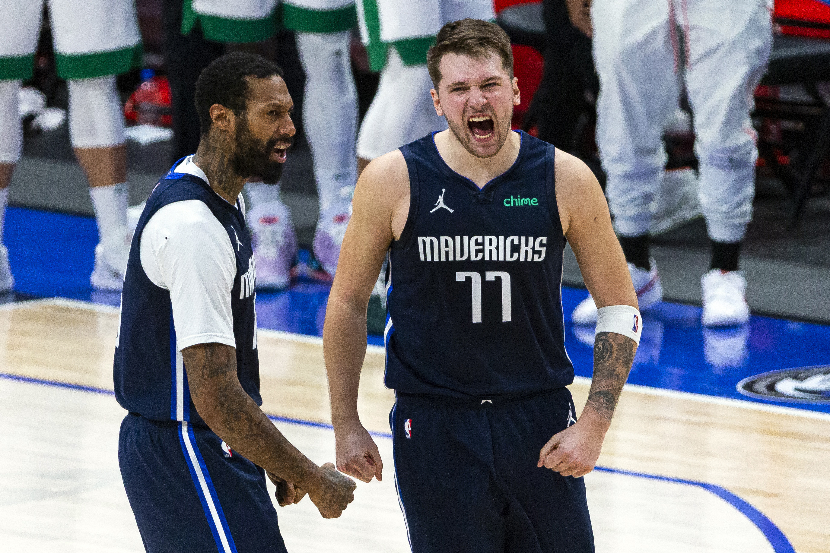 Dallas' Luka Doncic celebrates a late three-pointer against Boston Tuesday night.