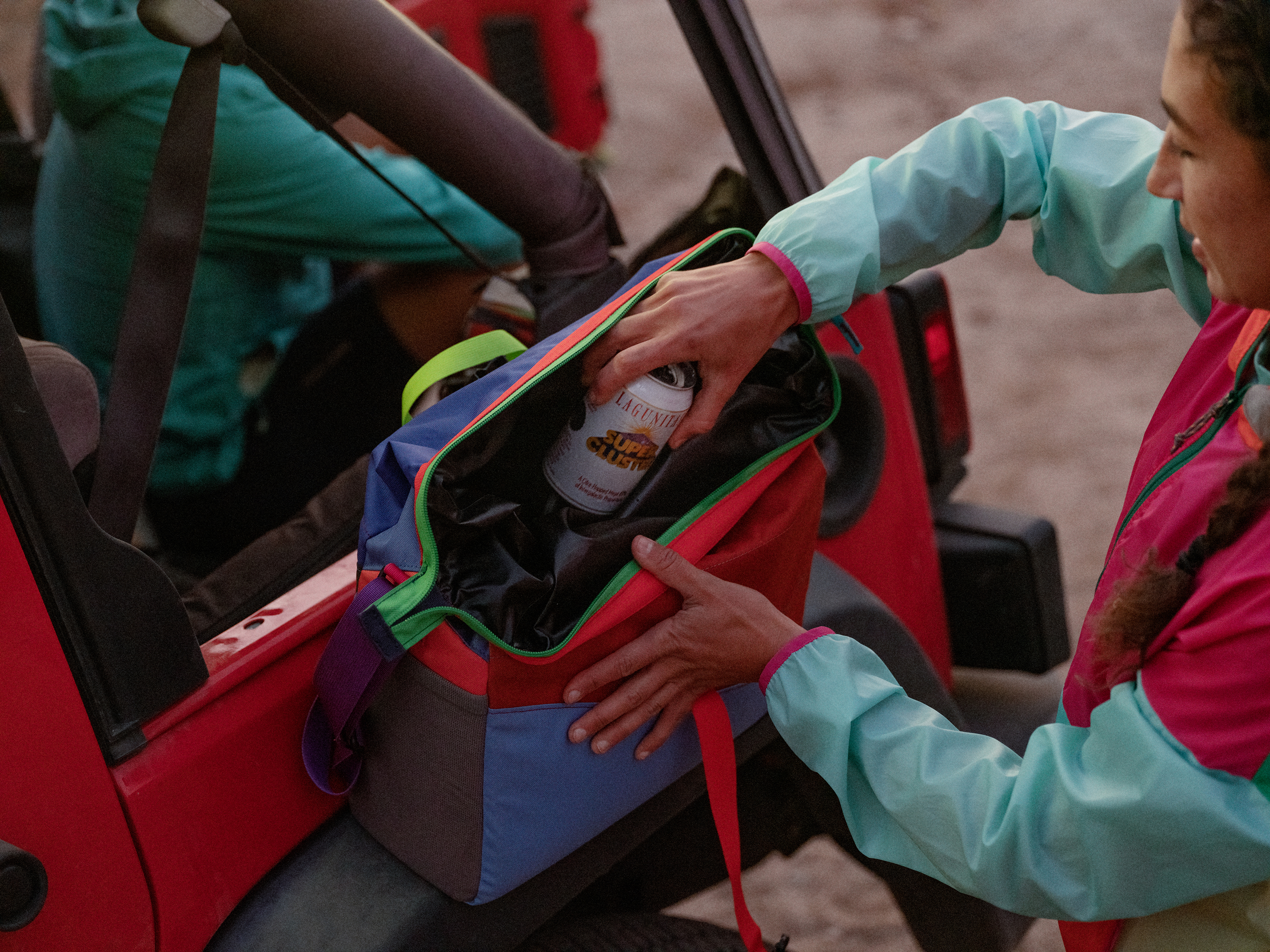 Pack up the colorful briefcase-size Cotopaxi cooler bag and hit the road this summer.
