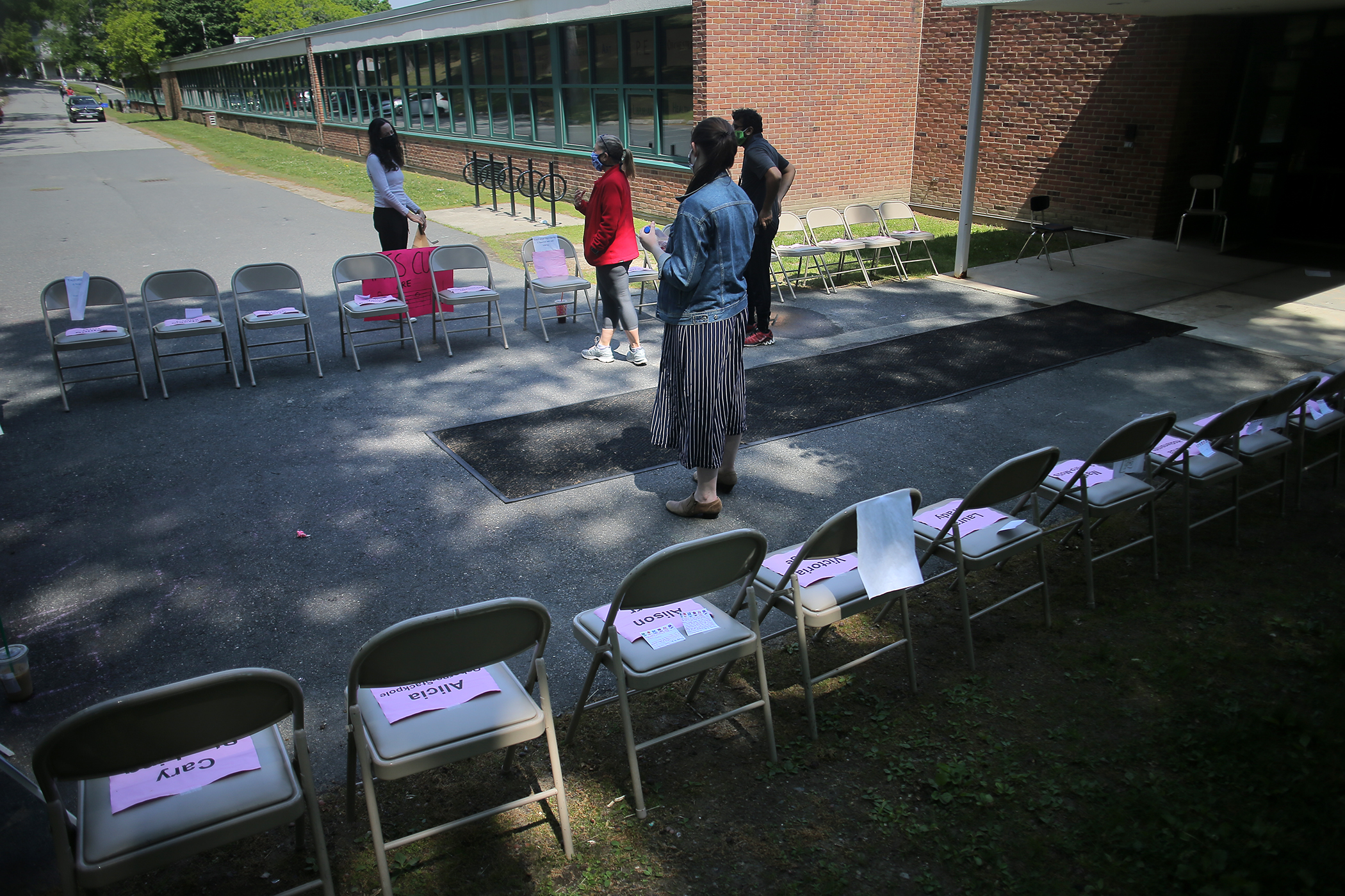 High schoolers organized a protest at the Heath School in Brookline last week. Signs listed the names of teachers who had received pink slips.