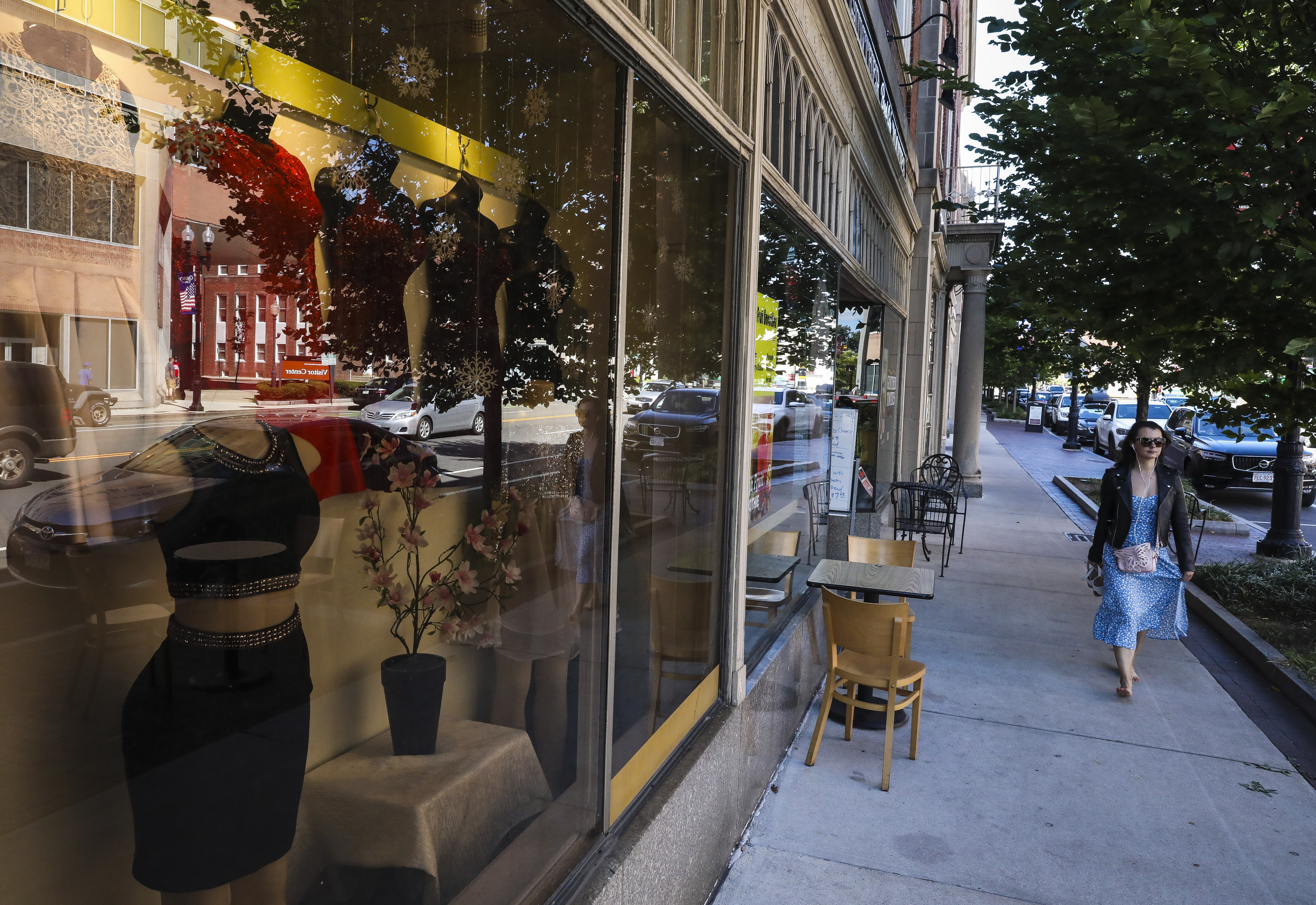 A woman walks down Hancock Street in Quincy Center.