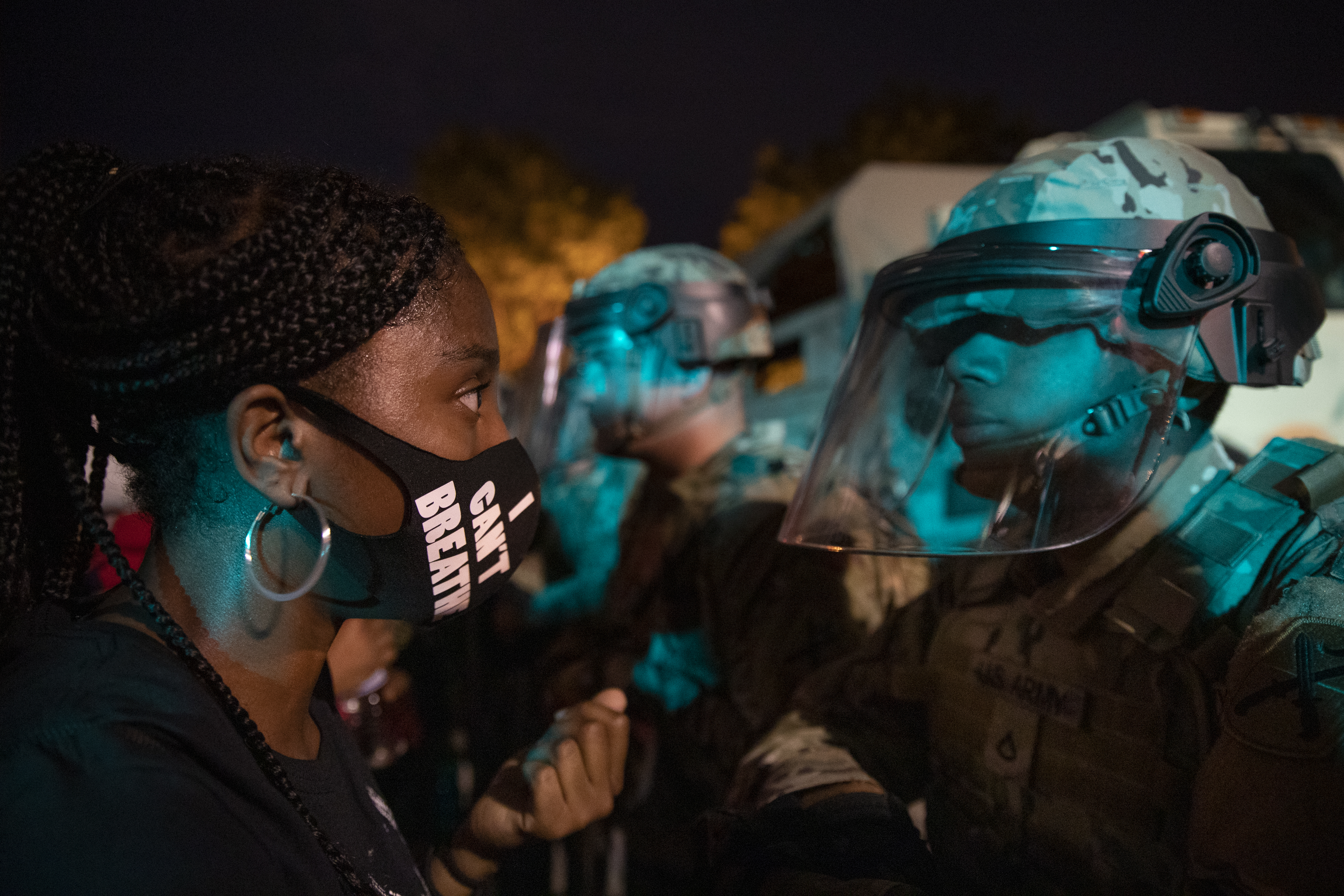 A demonstrator called out to a military line near the White House in protest the death of George Floyd Wednesday.