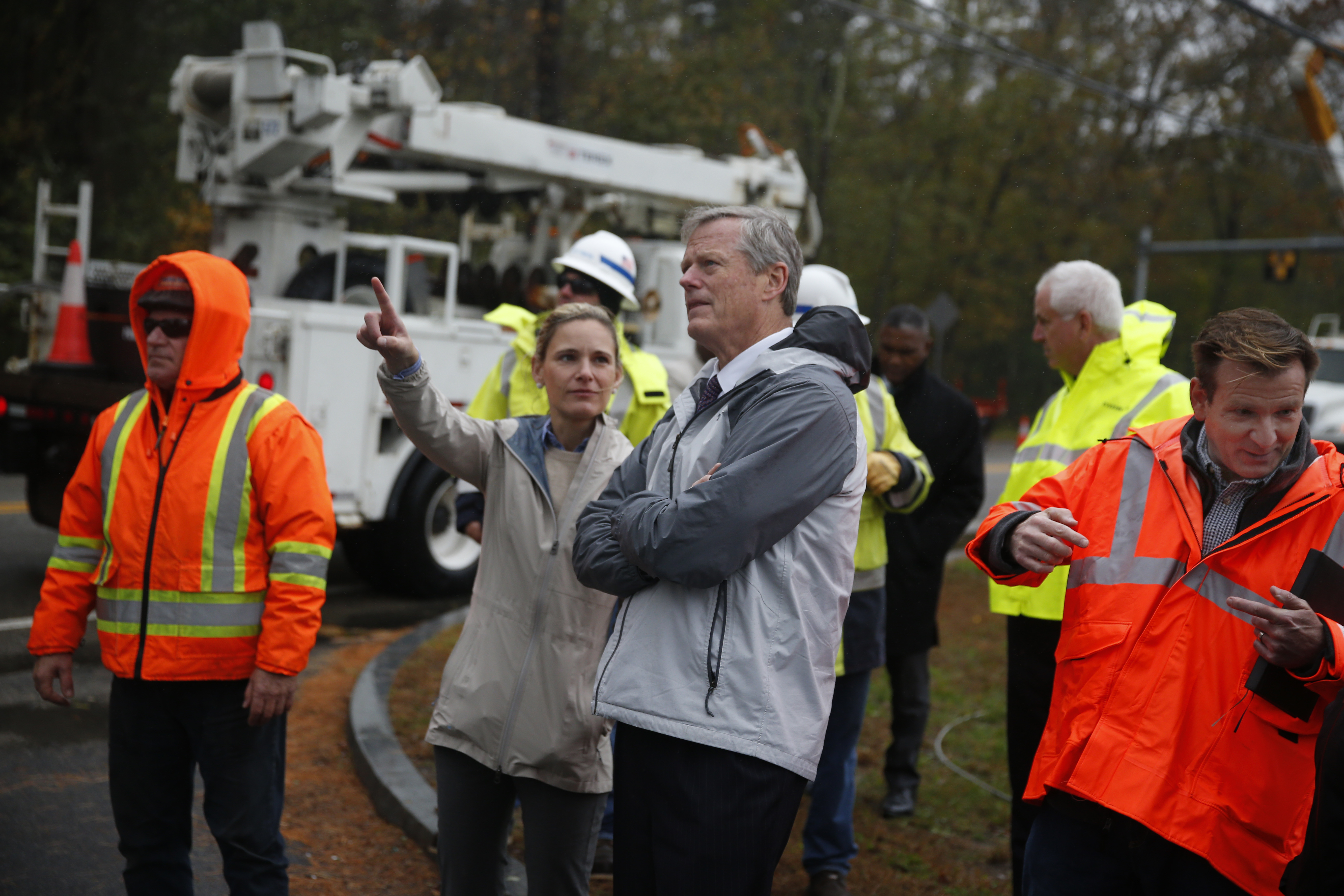 Secretary of Energy and Environmental Affairs Kathleen A. Theoharides (left) was with Massachusetts Governor Charlie Baker (right) and others in Scituate on Wednesday to get an update on storm damage on the South Shore. They were looking at restoration work being done in front of the Scituate Public Safety Complex on Route 3A.