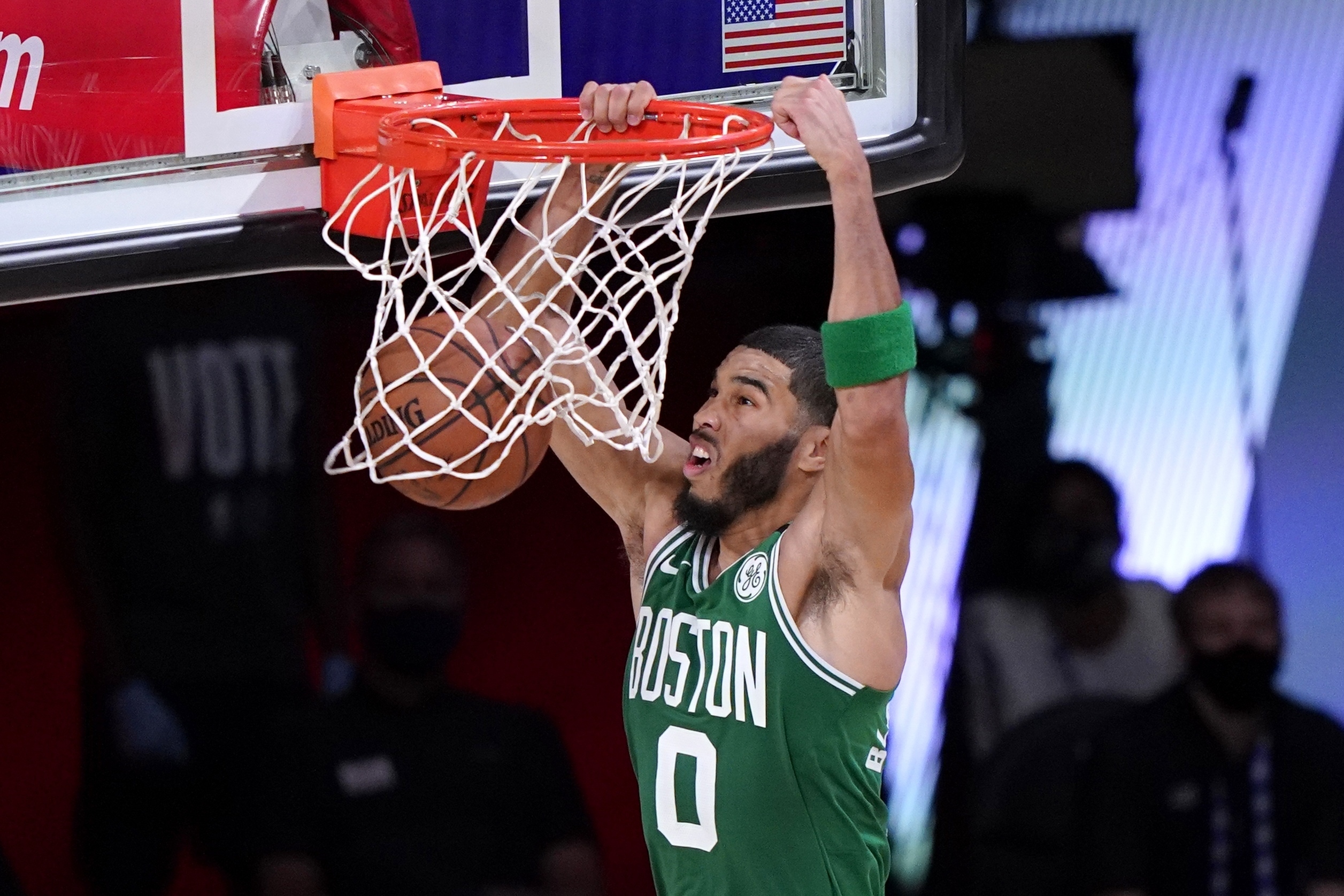 Jayson Tatum dunks in the first half of Saturday's game.