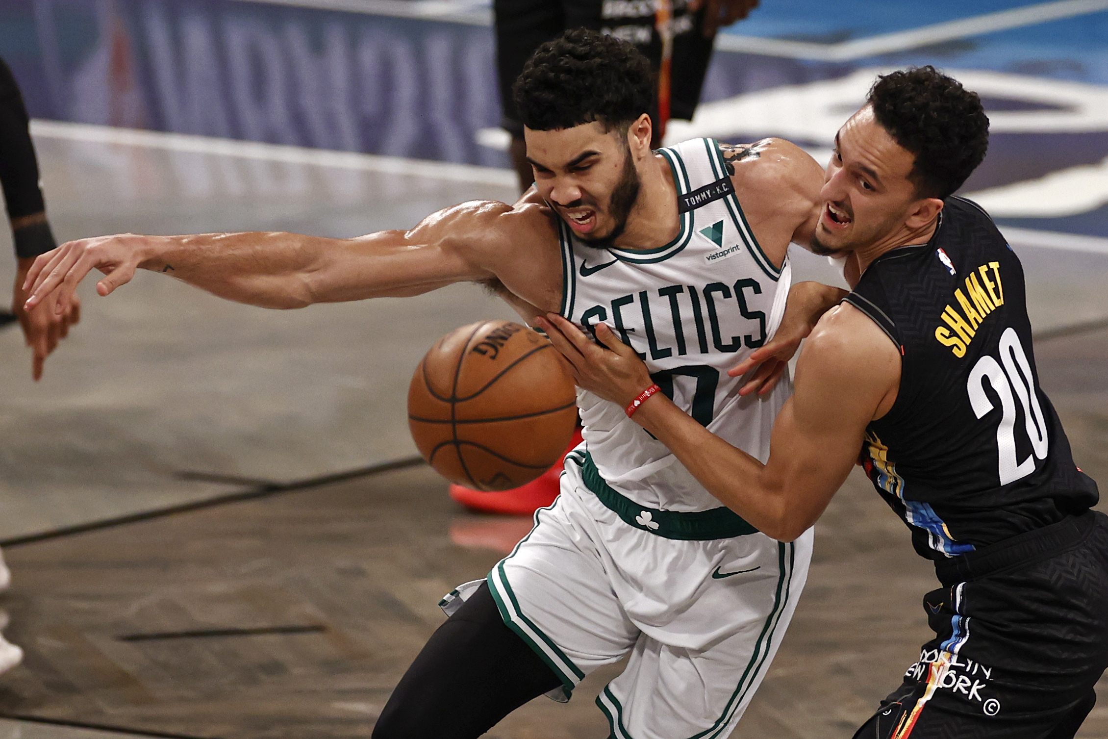 Jayson Tatum and Brooklyn Nets guard Landry Shamet battled for a loose ball in the second half.