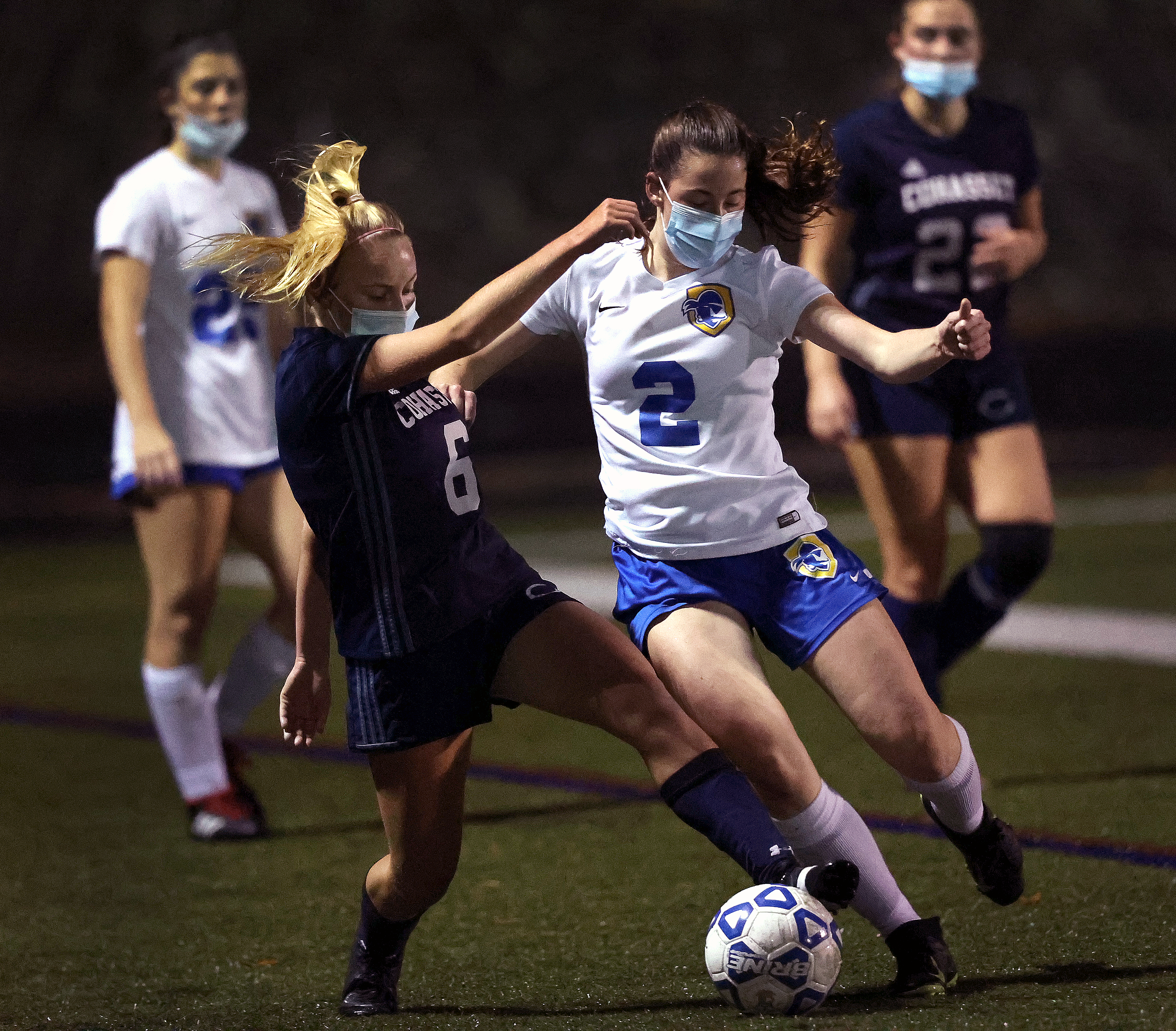 Cohasset's Gracyn Lord (6) and Hull's Mattie Tuchman (2) battle for possession in Friday night's South Shore League Tobin final.