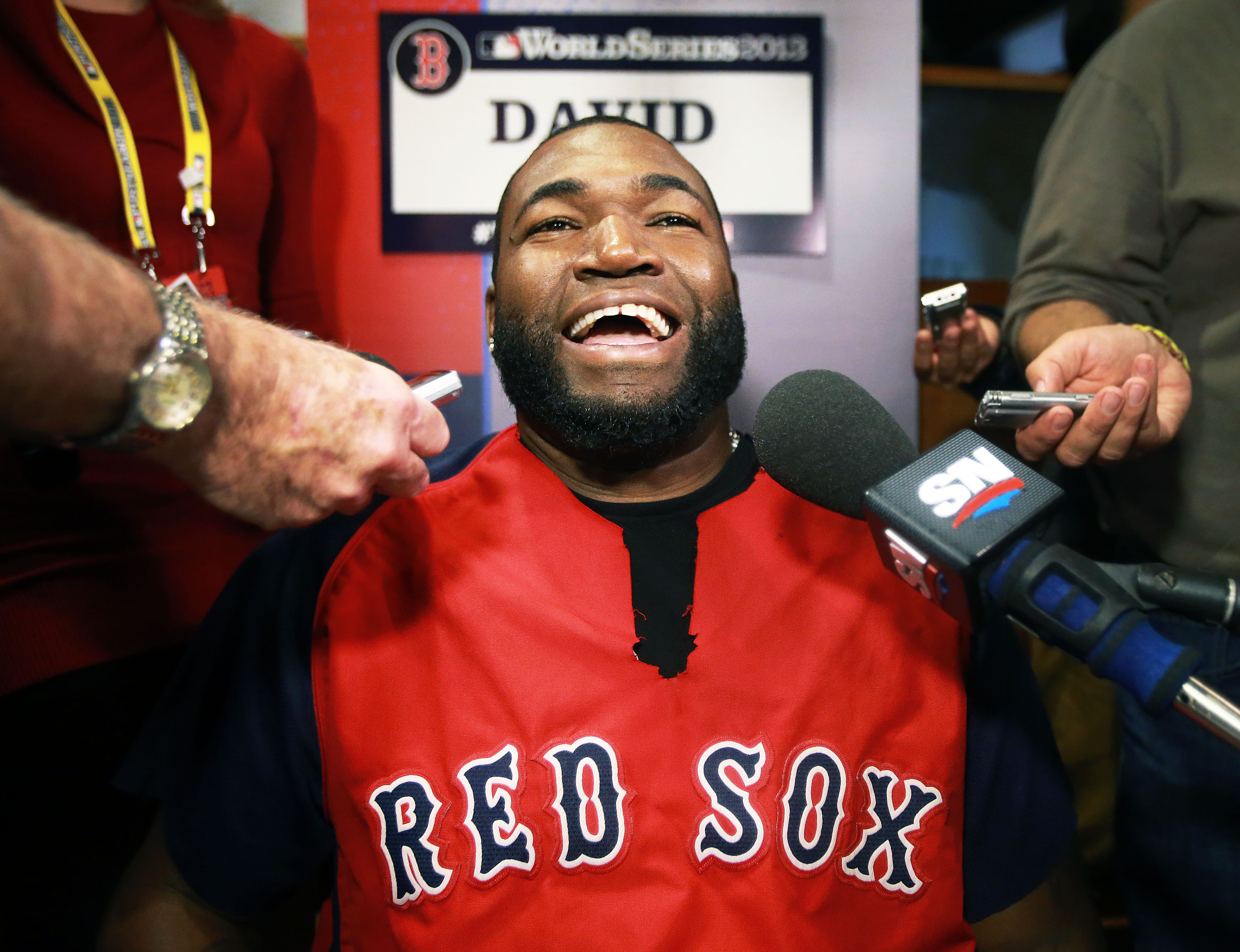 The Red Sox faced the Cardinals in the World Series that year. Here, Ortiz is shown with a smile on his face during media day ahead of the games.