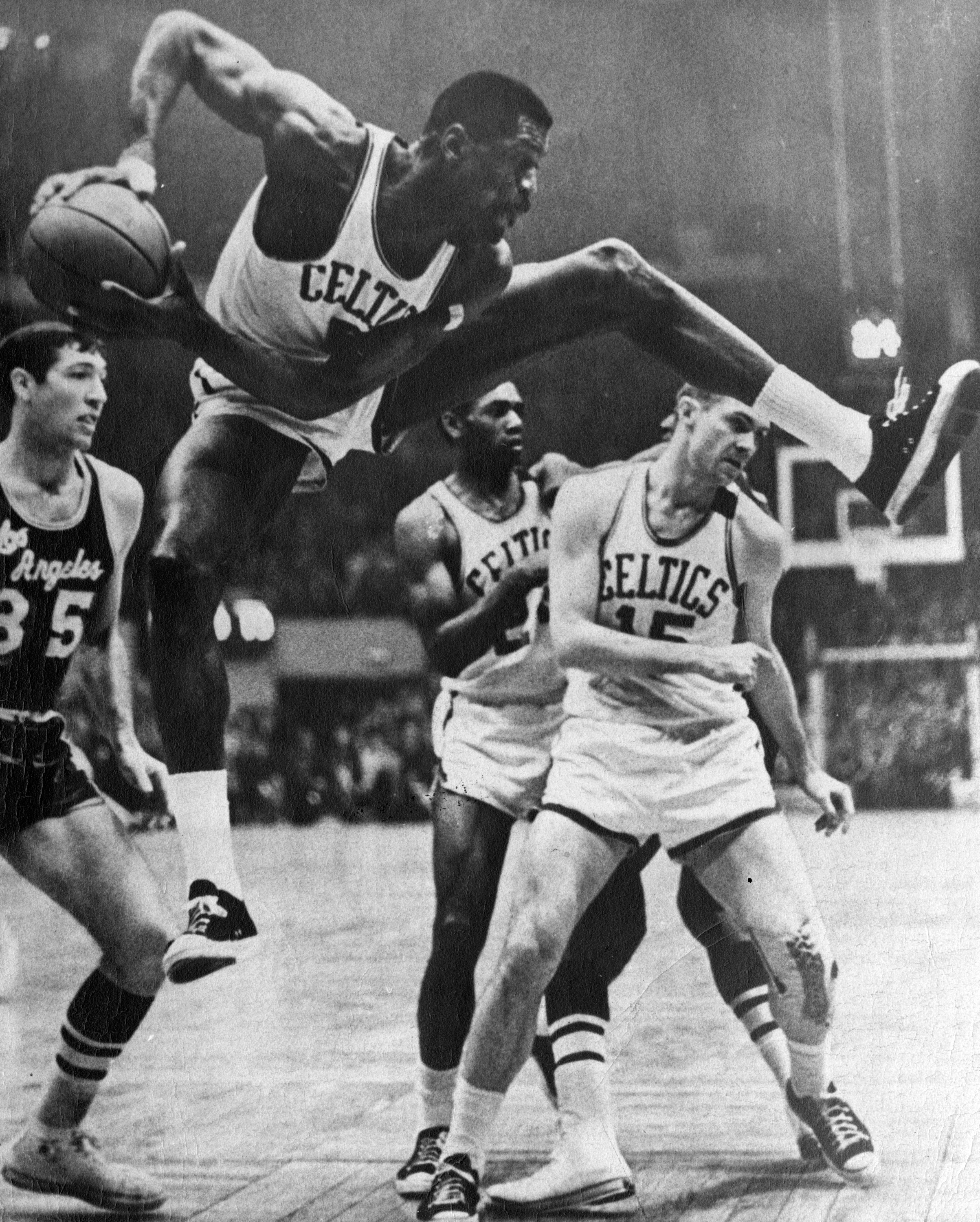 Bill Russell out-rebounds them all during an April 1965 game.