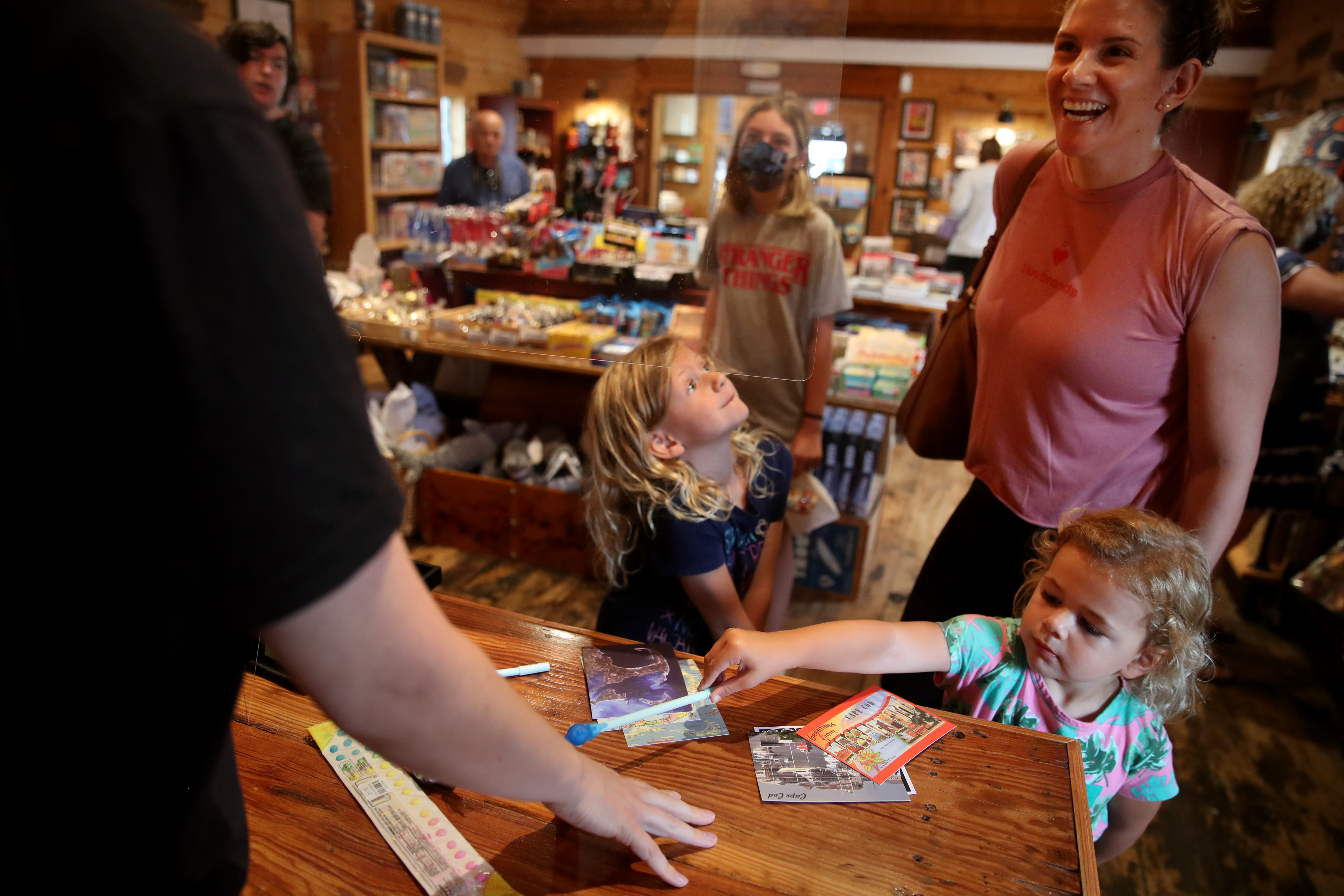 Liz Coakley and her daughters Ayla, 5, (left) and Skylar, 3, purchased candy, souvenirs, and postcards at Murphy’s General Store in Harwich Port.