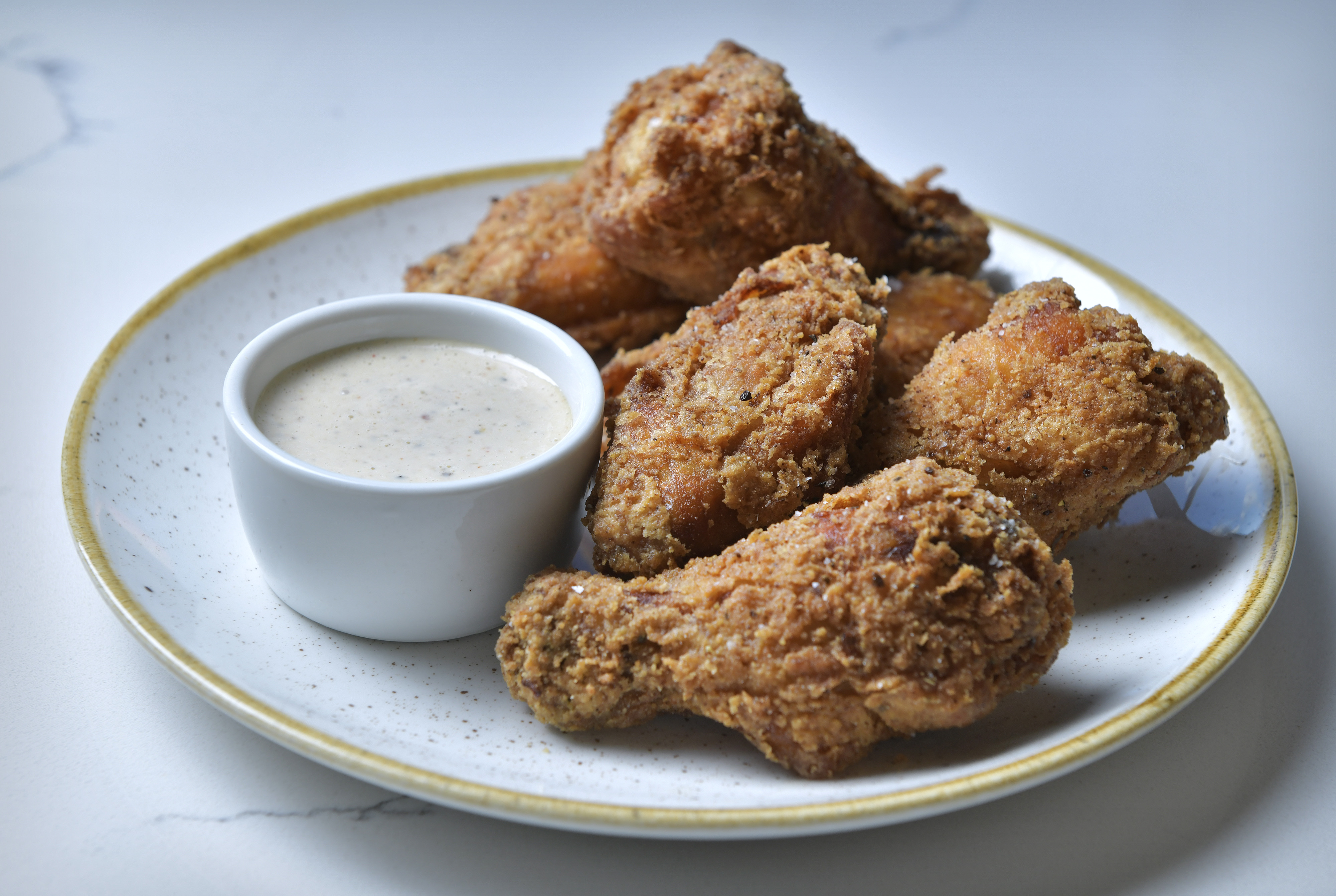 Buttermilk fried chicken with white BBQ sauce at Buttermilk & Bourbon in Watertown.