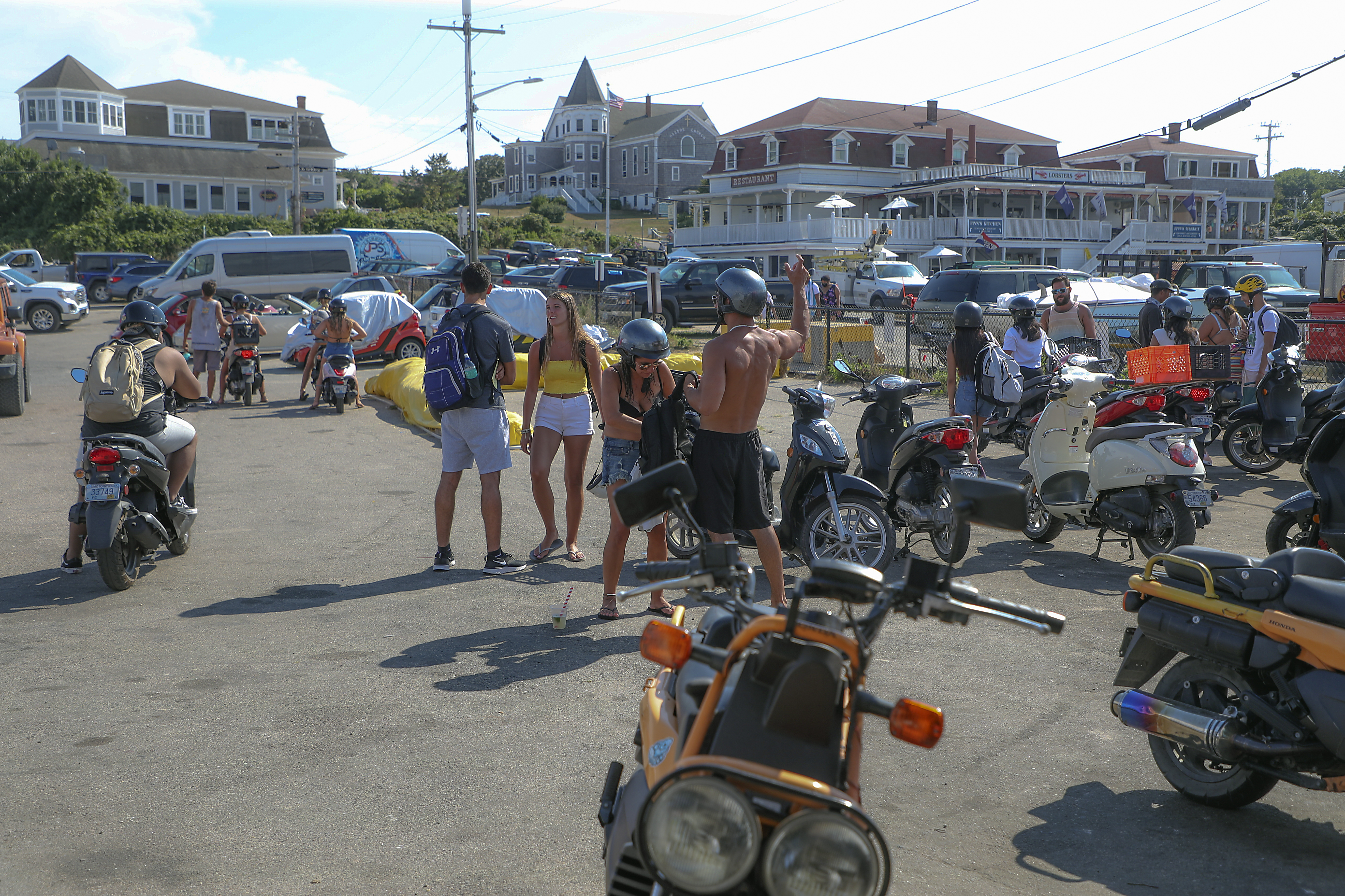 Many tourists rent mopeds on the island. The moped rental businesses hired security officers to help curb traffic infractions by riders.