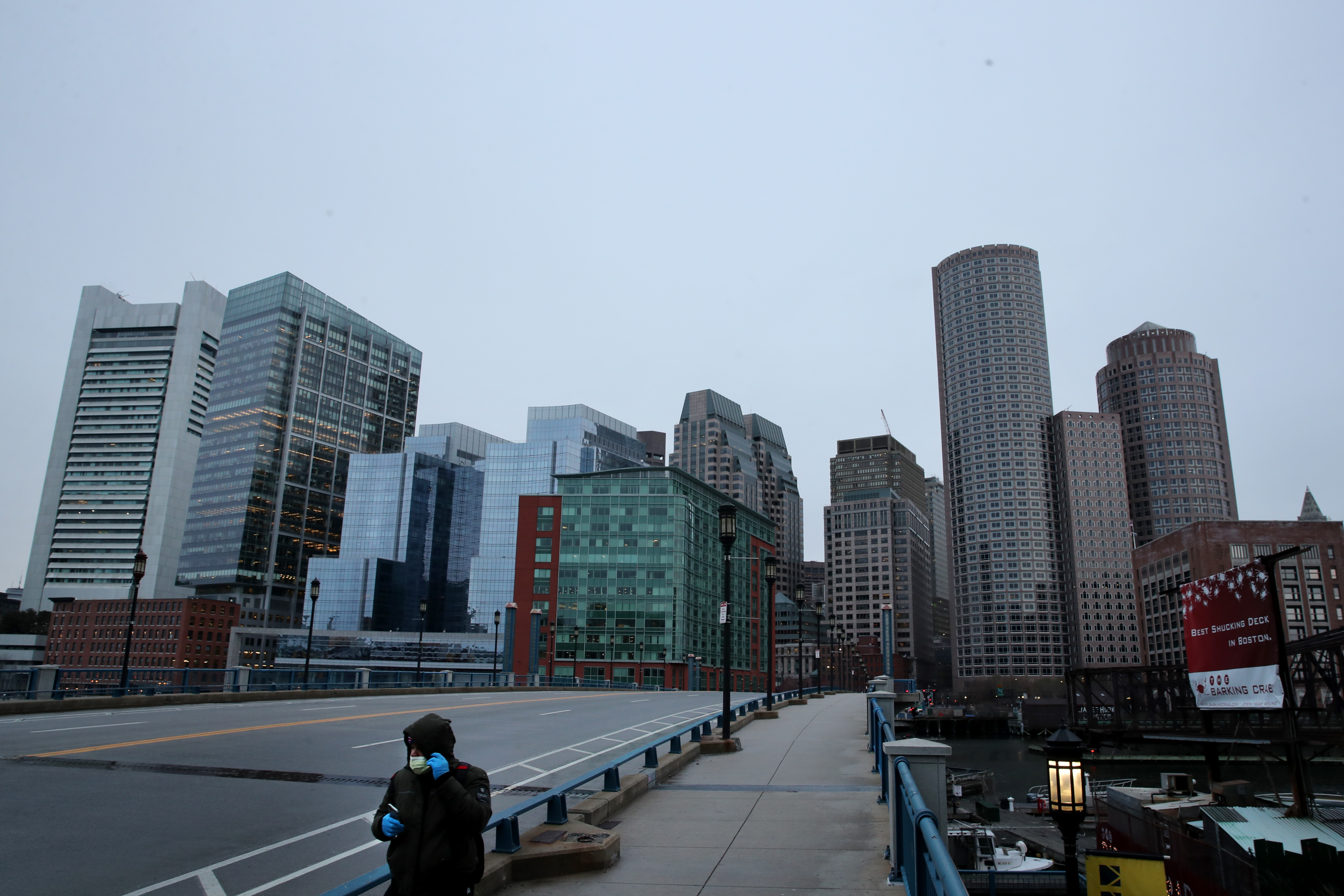 Boston, MA - 4/2/2020:  A man crosses the empty Evelyn Moakley Bridgeon Seaport Blvd in Boston, MA on April 02, 2020. (Craig F. Walker/Globe Staff) 