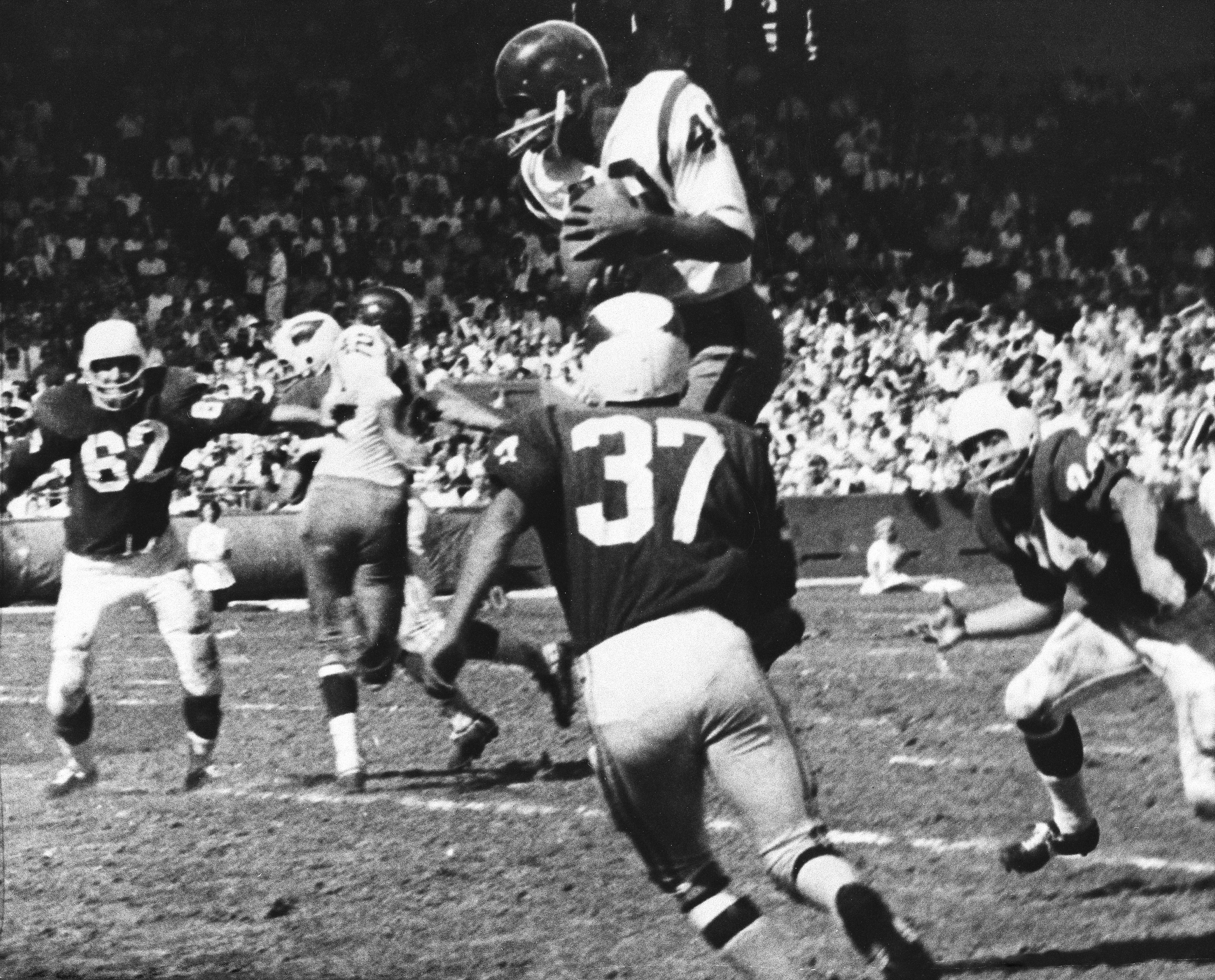 When Bobby Mitchell (top) retired in 1968, he had the second-most all-purpose yards in NFL history.