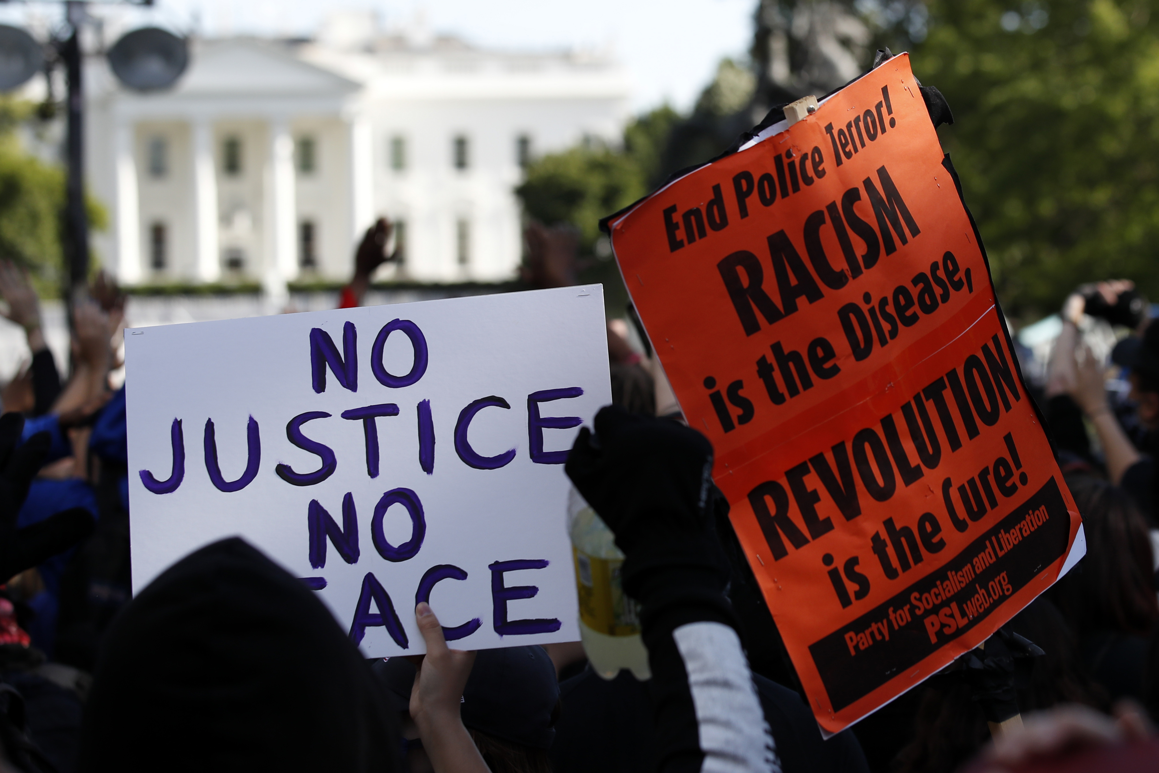 Demonstrators gathered to protest the death of George Floyd Sunday near the White House in Washington, D.C.