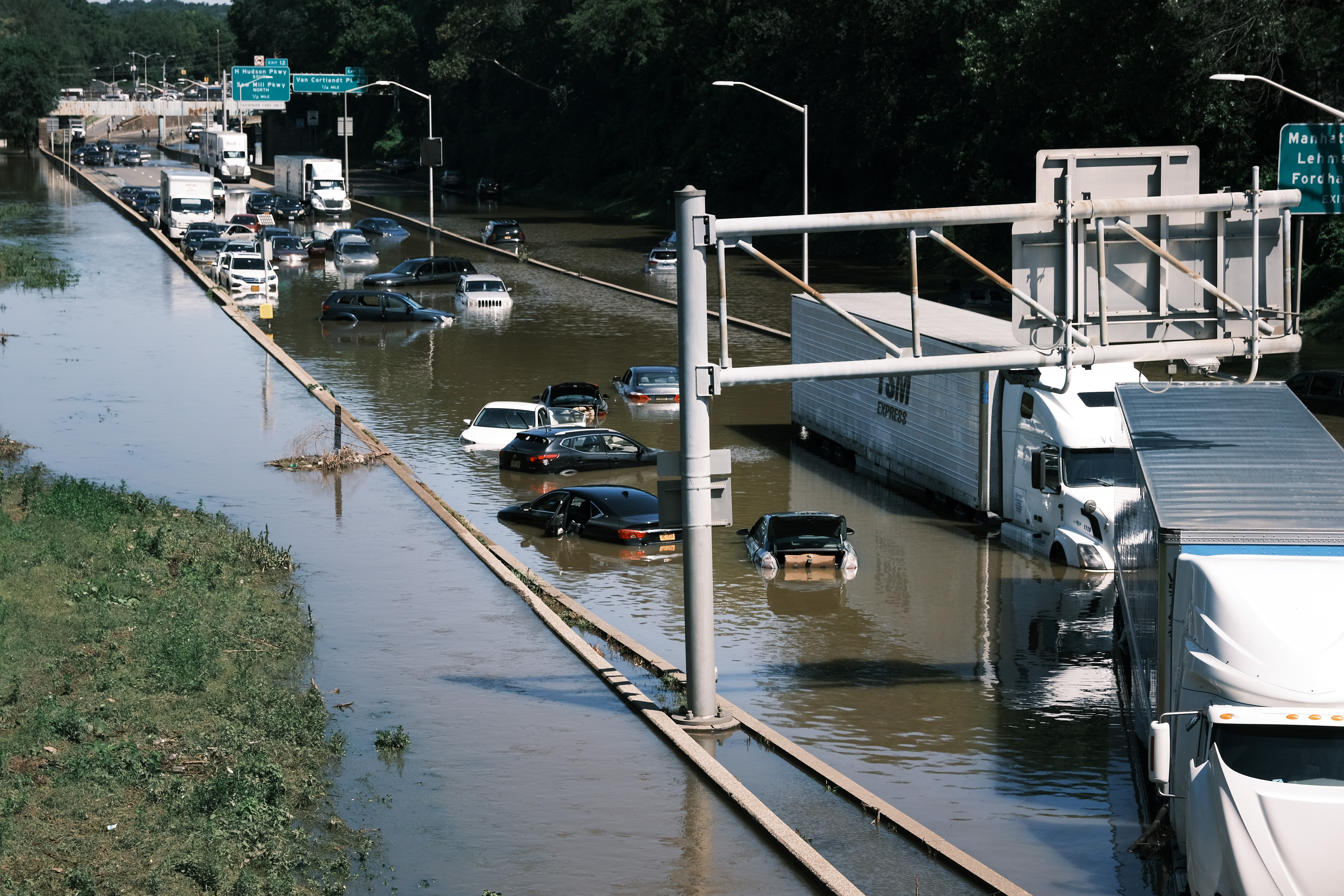 Cars were abandoned on the flooded Major Deegan Expressway on Thursday in the Bronx following a night of heavy wind and rain from the remnants of Hurricane Ida.