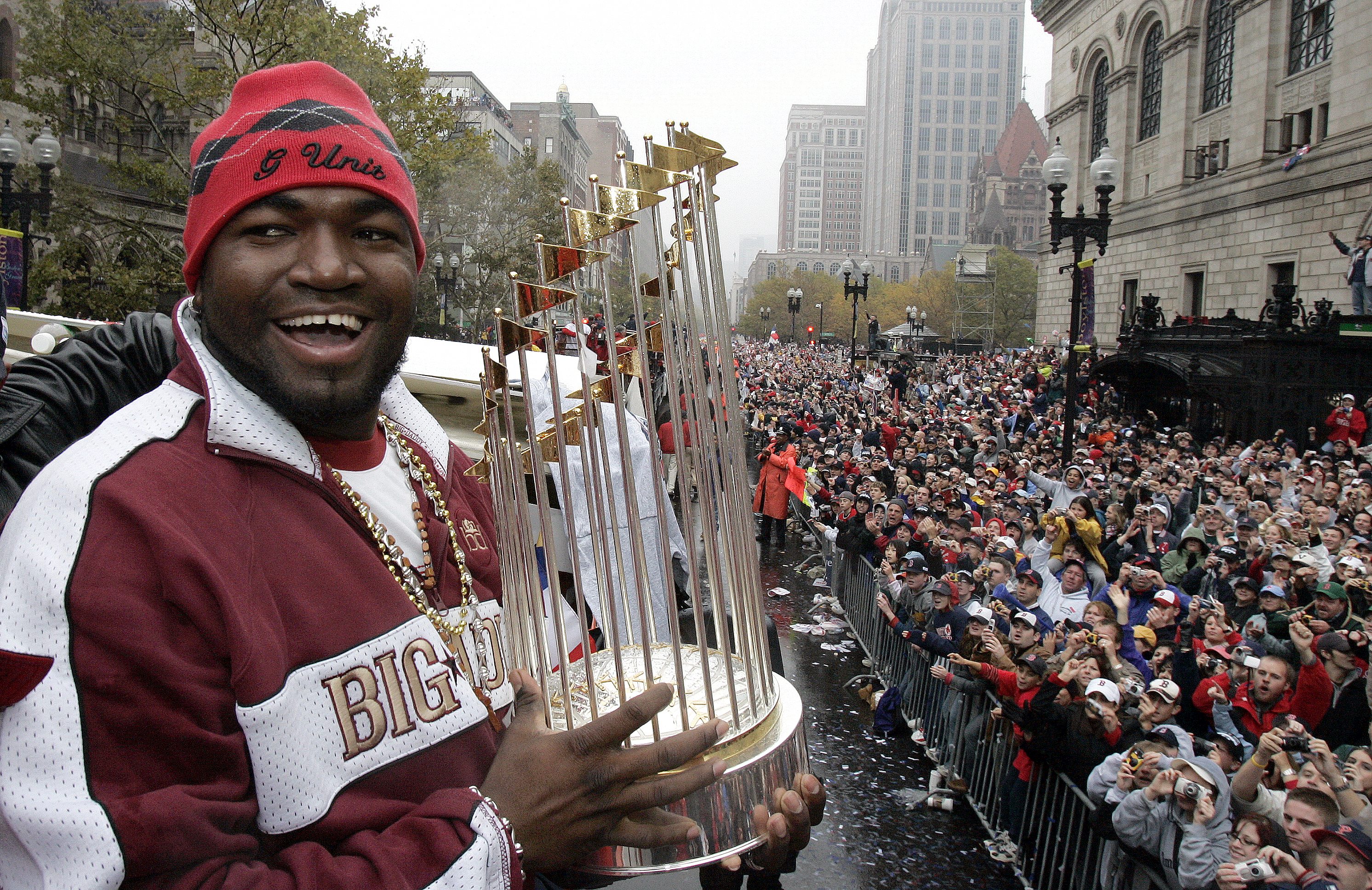 Fans are packed like sardines on Boylston Street to catch a glimpse of Ortiz and the World Series trophy during the Red Sox' rolling parade on Oct. 30, 2004, to celebrate breaking the 86-year-drought. 