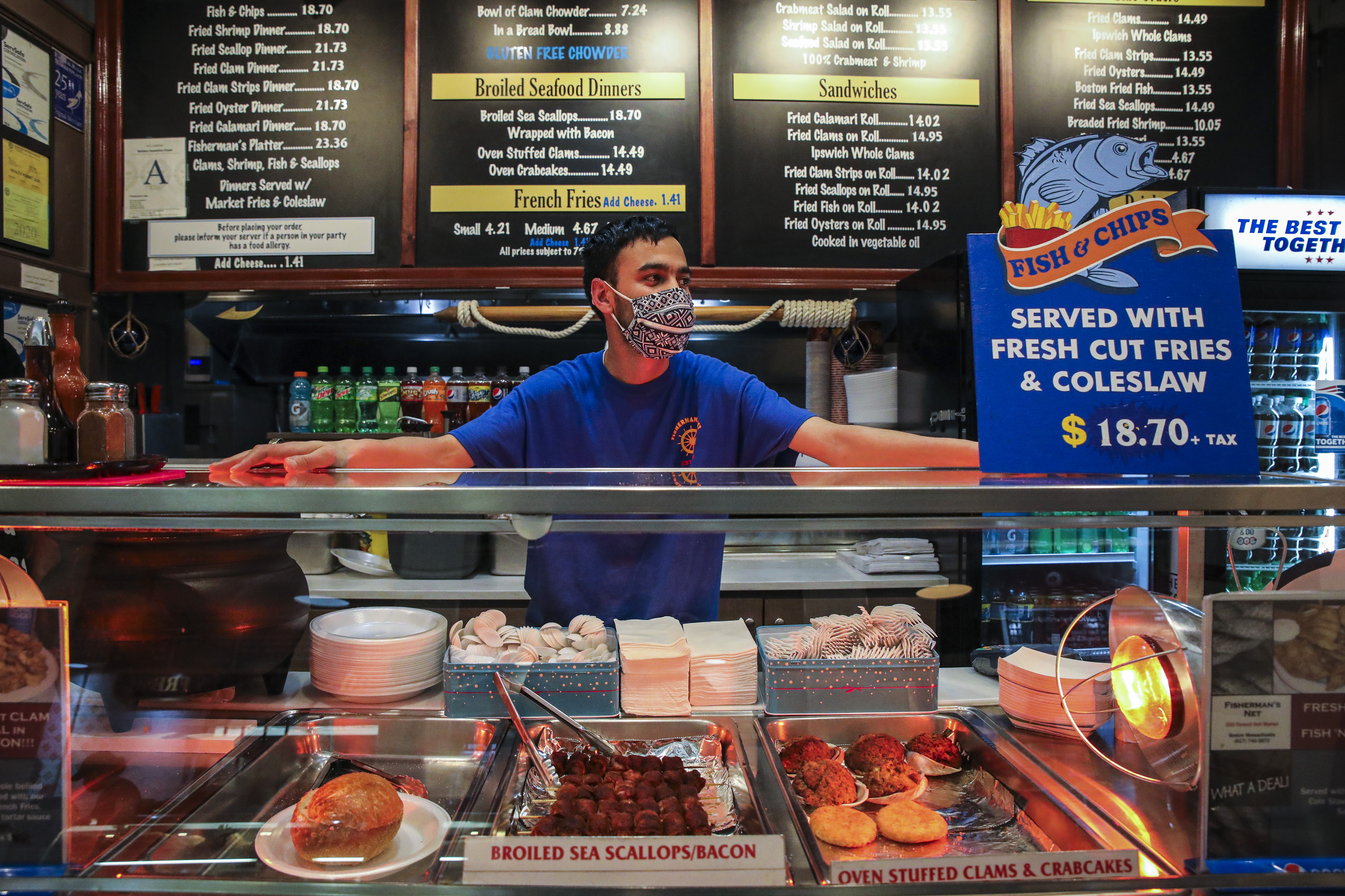 Ajit Adhikar, the chef at Fisherman’s Net, stood behind the counter. Ashkenazy waived a few months of back rent and gave the business a payment plan to make up the rest.