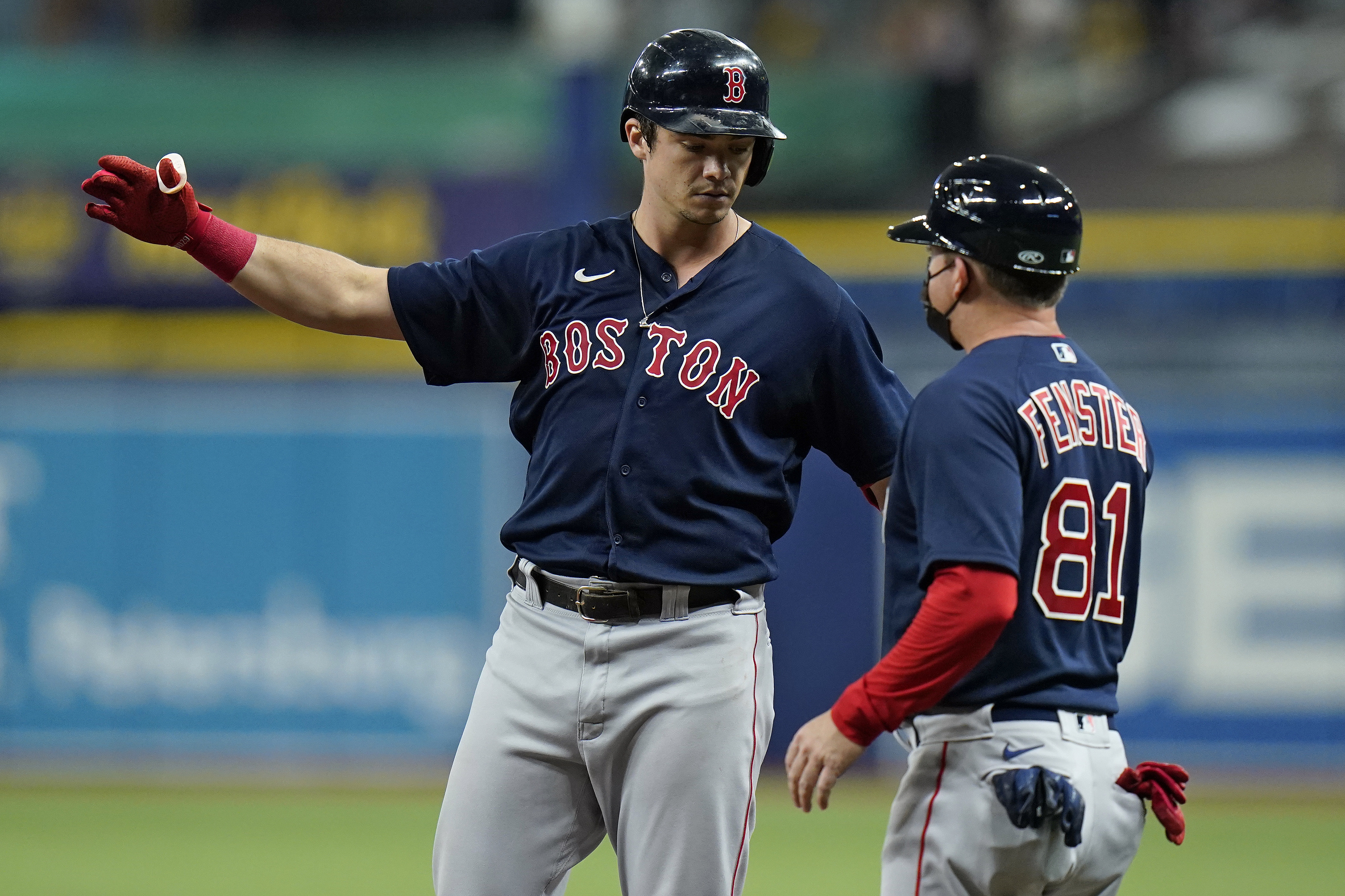 Bobby Dalbec celebrates a fifth-inning RBI single with first base coach Darren Fenster Thursday night.