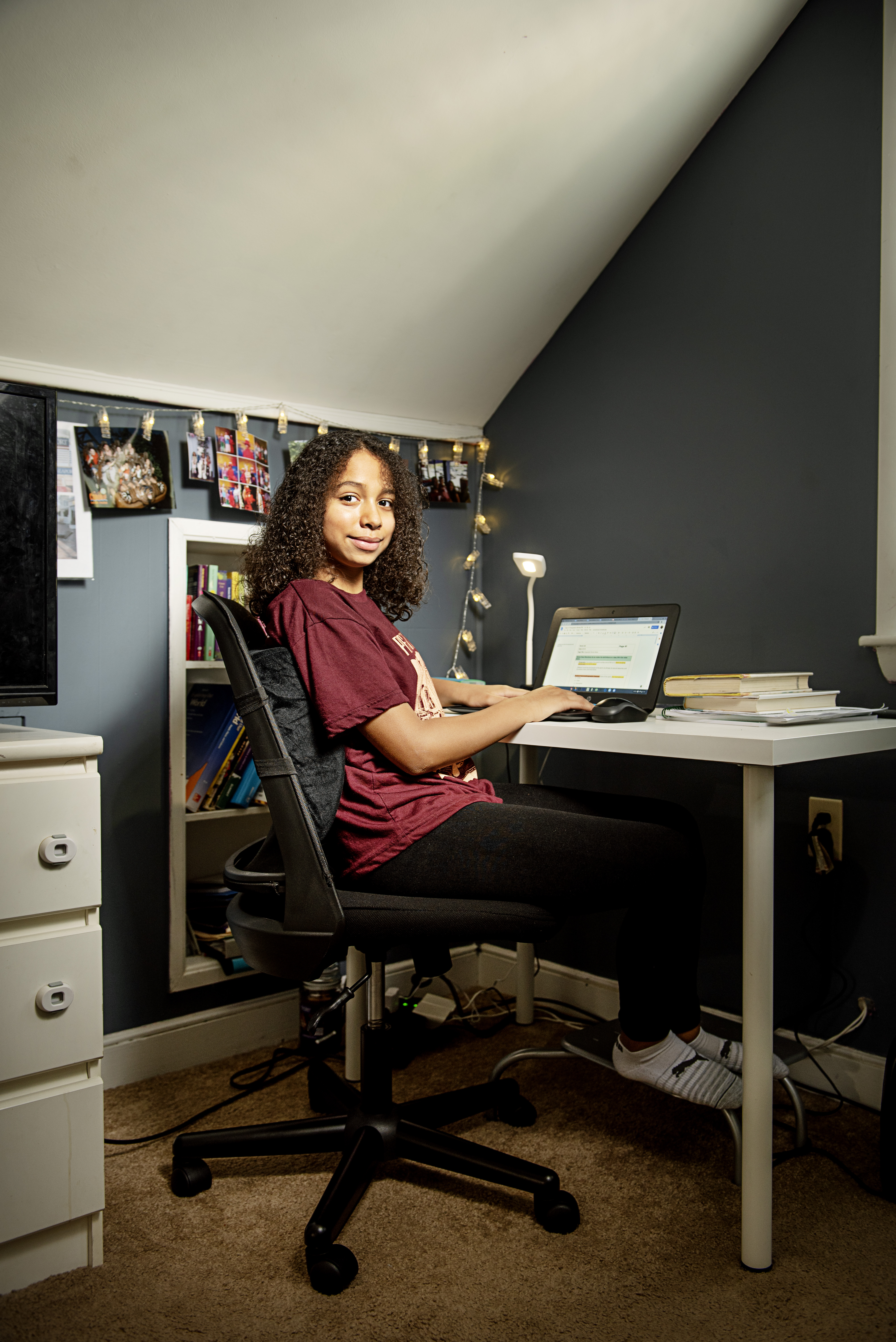 Juli Thomas-Arbaje, a seventh-grader and daughter of METCO president Milly Arbaje-Thomas, in her bedroom space for online school.