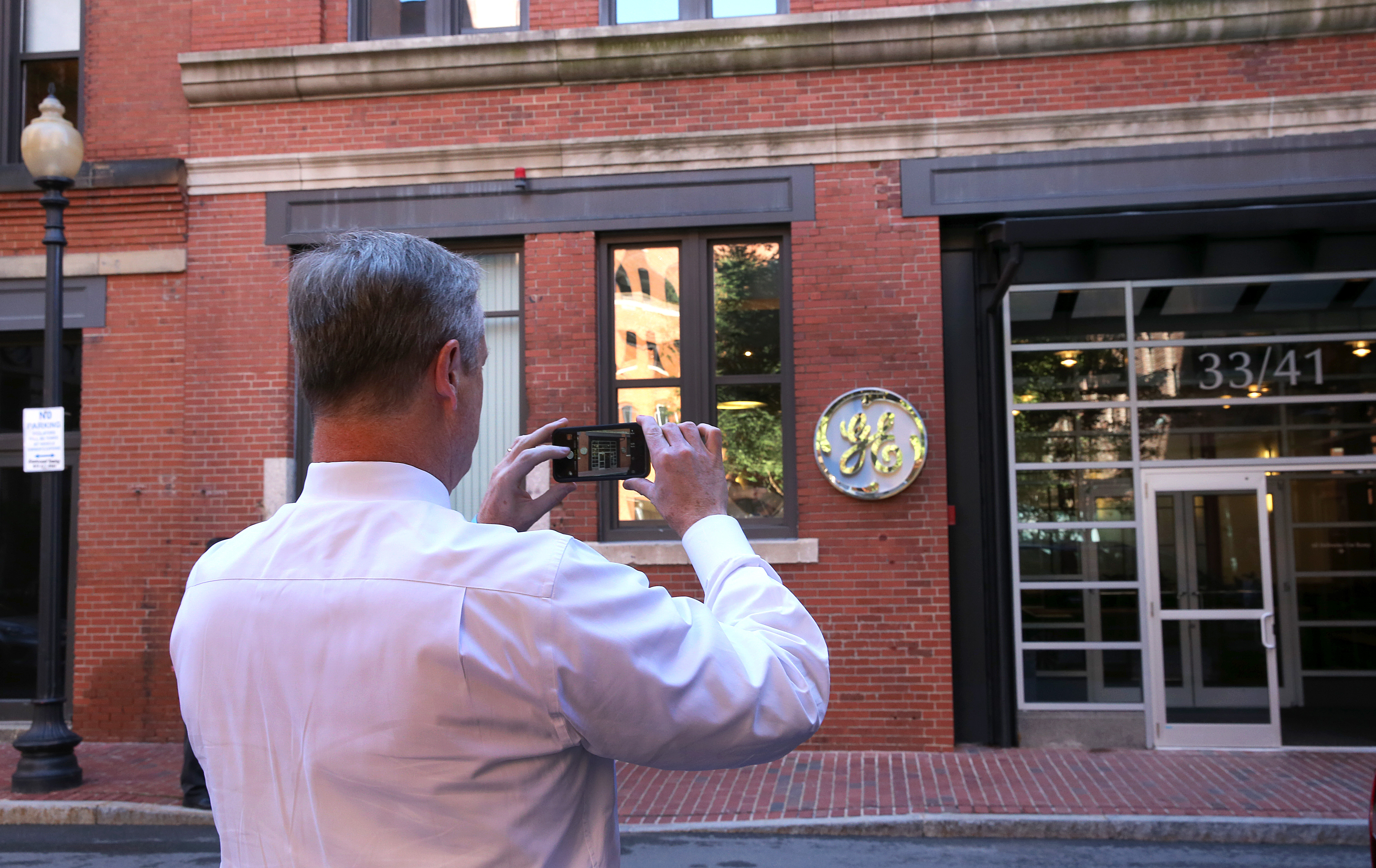Governor Charlie Baker took a photo of the temporary General Electric headquarters in Fort Point in 2016.