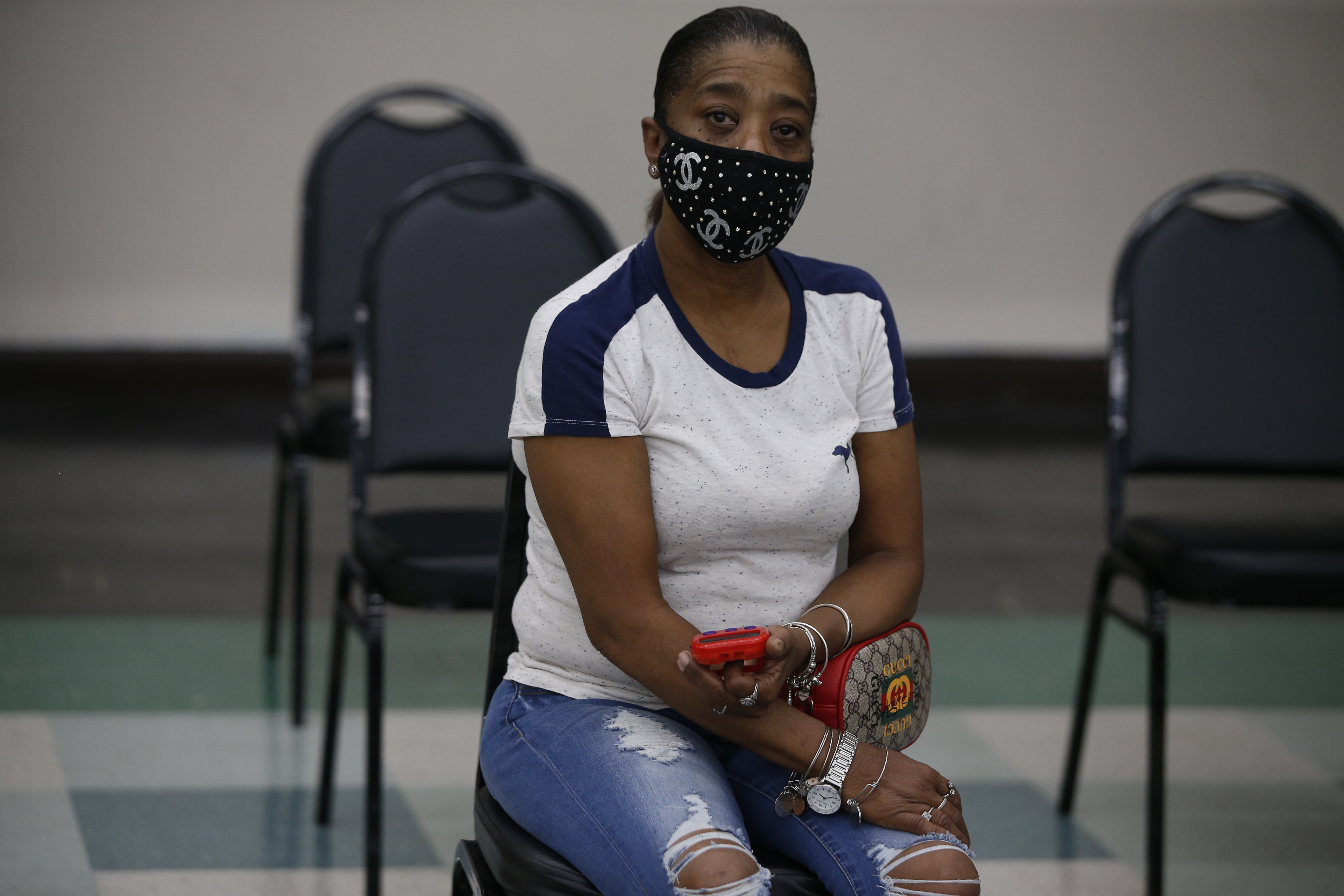 Shirley Walker, waited with a timer set to 15 minutes, after getting her COVID-19 vaccination at the Prince Hall Grand Lodge in Dorchester.