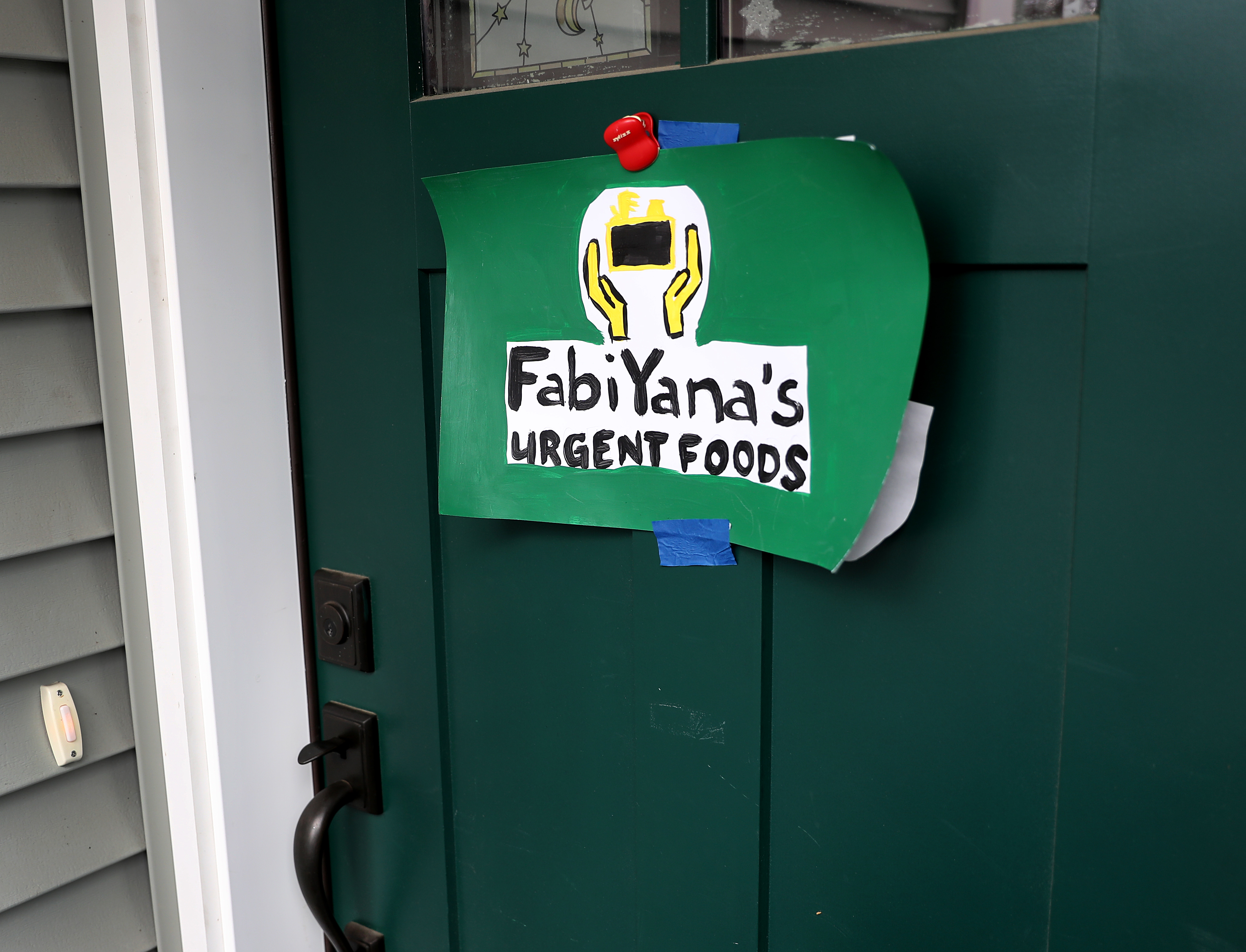A sign on the doorway of Weinstein-Jones home.