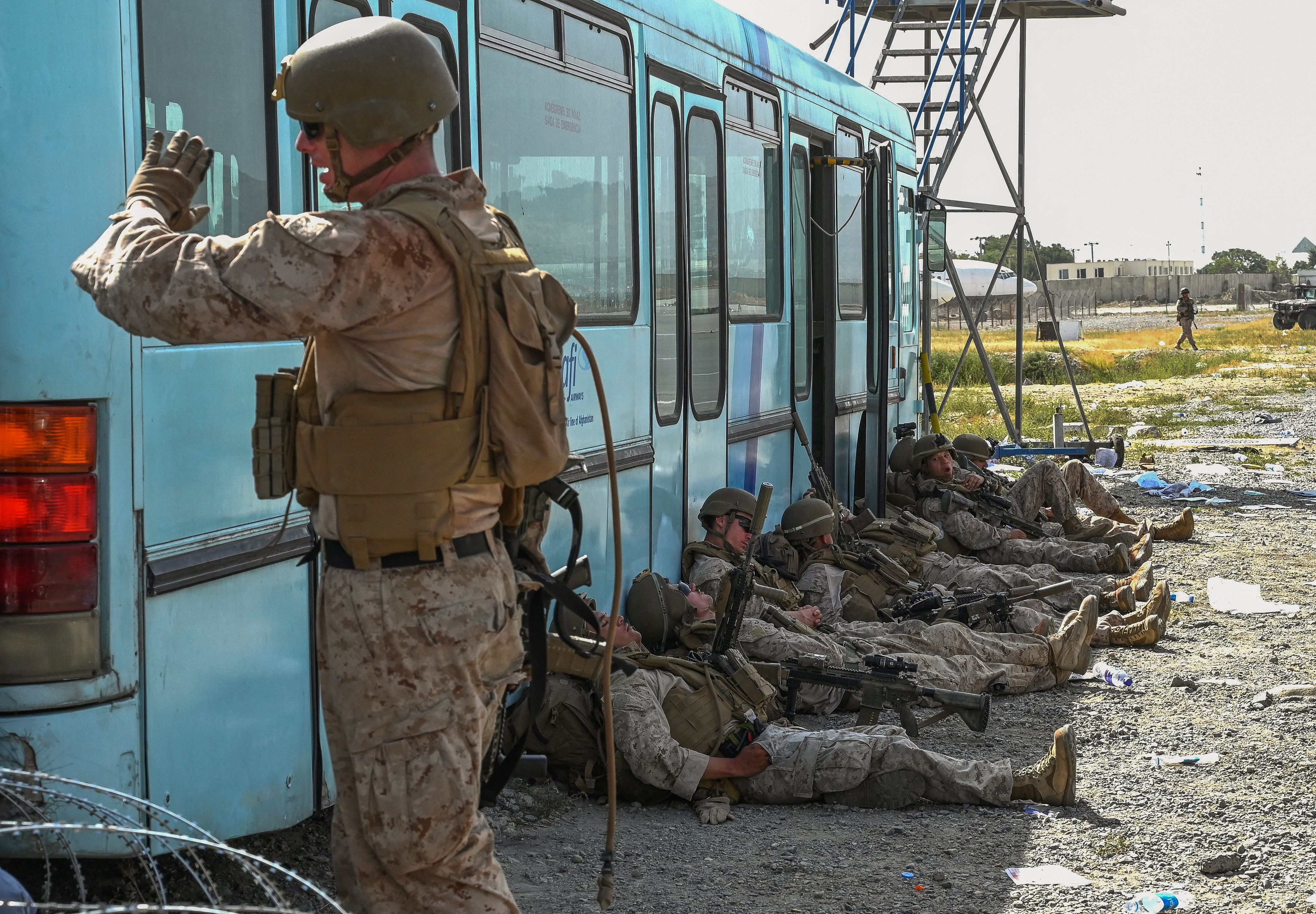 US soldiers rested as Afghan people (not pictured) waited to leave the Kabul airport.