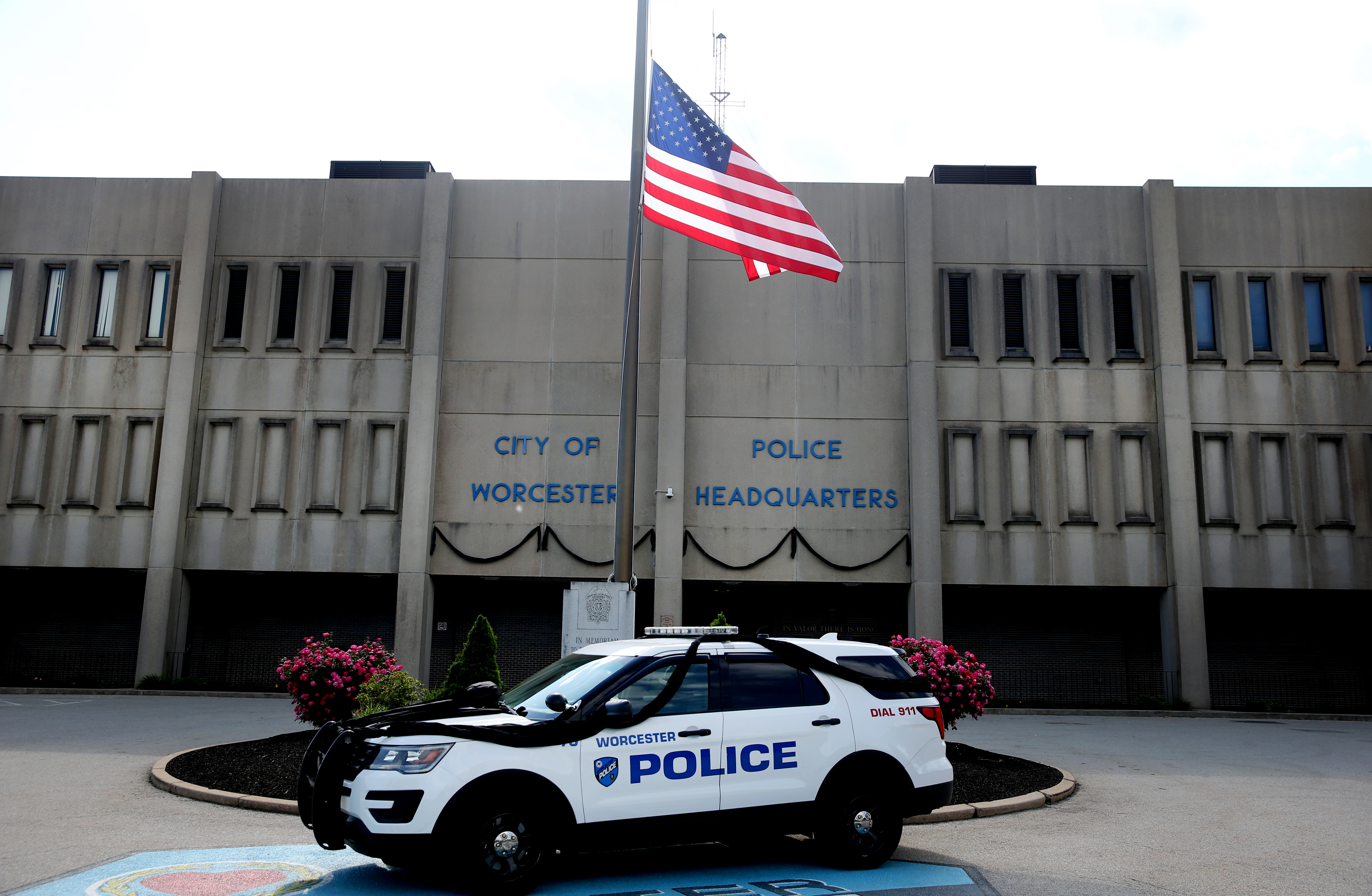 At Worcester Police headquarters, black bunting hung over the entrance, and more was wrapped a police cruiser by the door.