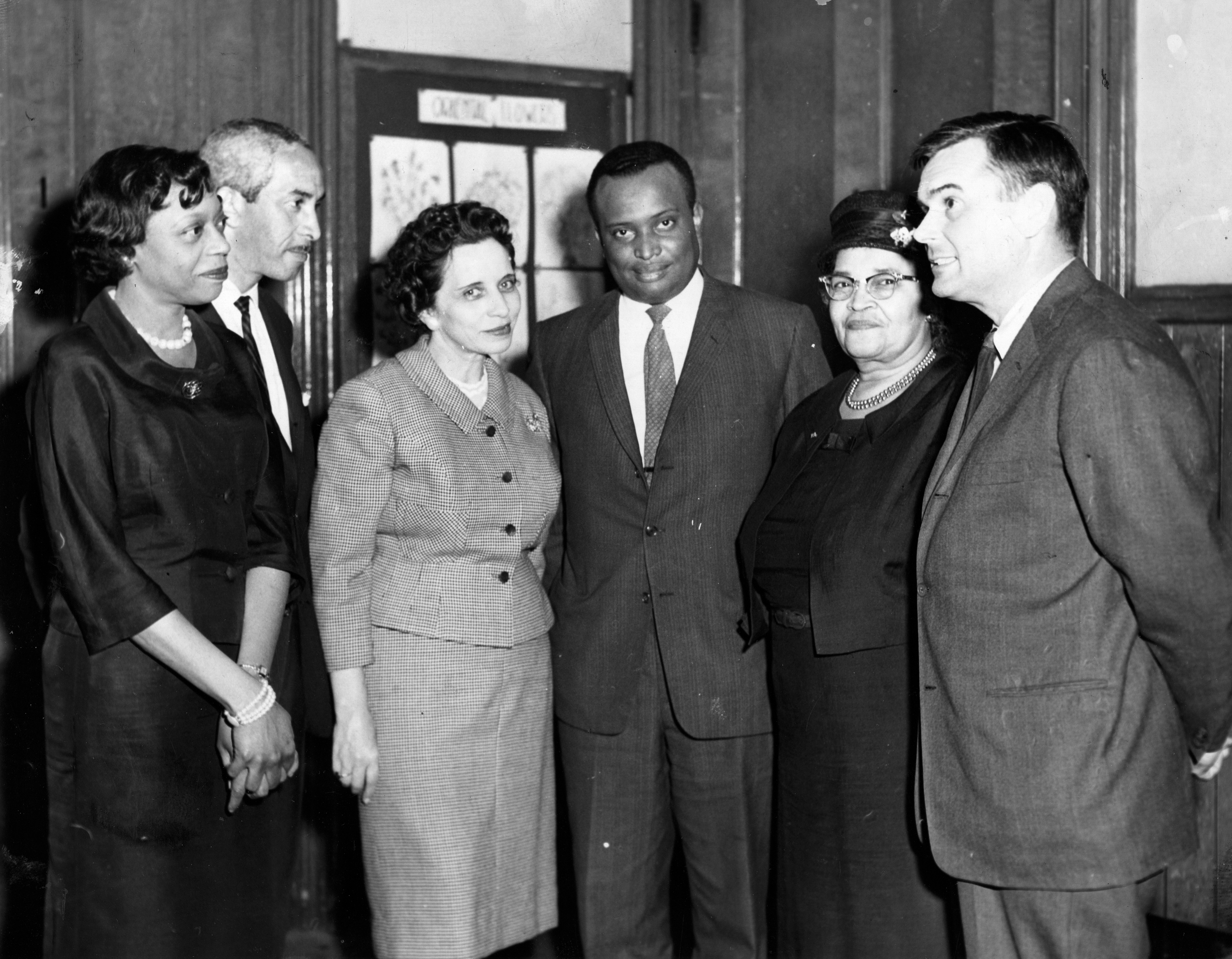Mr. Carrington (third from right), then vice president of the Boston NAACP branch, with (from left) Rheable M. Edwards, chairwoman of the Boston branch of the NAACP housing committee; Jack E. Woods, specialist in housing; Ellen Tarry, regional intergroup relations official with the Housing and Home Finance Agency; Melnea Cass, president of the Boston NAACP branch; and Boston Development Administrator Edward J. Logue. The group was meeting on the problems of urban renewal in Lower Roxbury.
